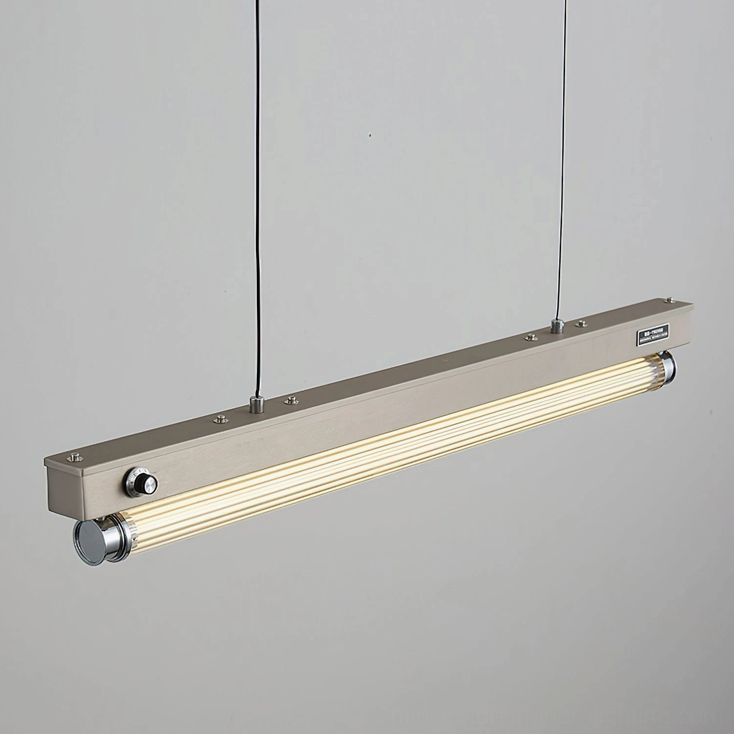 Close-up detail of Hiromi pendant light featuring brand label and frosted acrylic diffuser tube