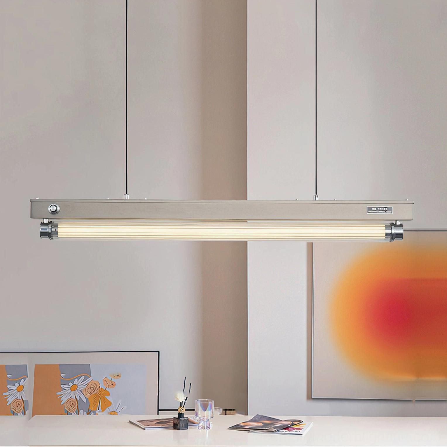 Hiromi brushed nickel pendant light installed above dining table in modern home interior