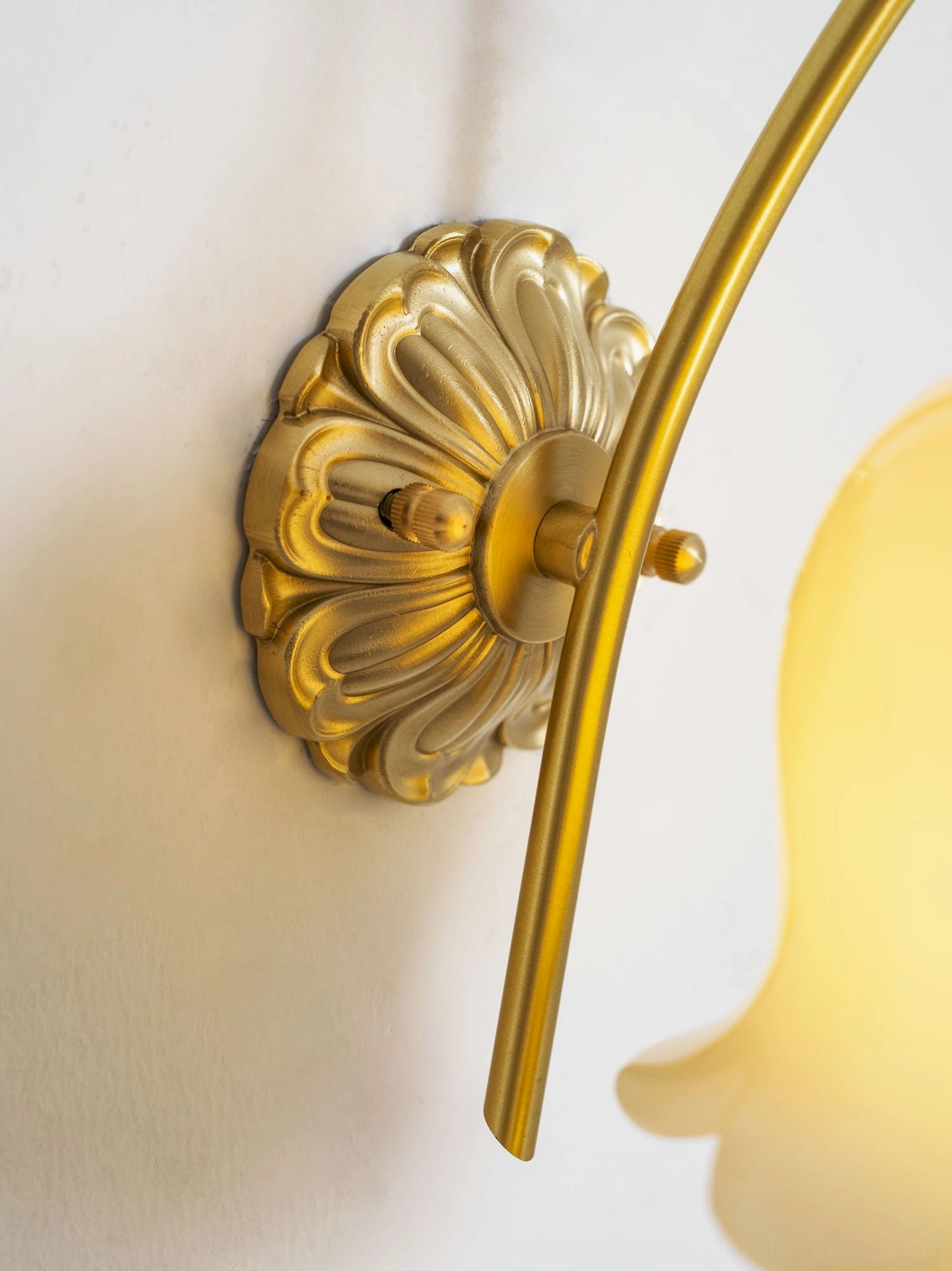 Full installation view of lily of the valley wall lamp in elegant home office or bedroom setting