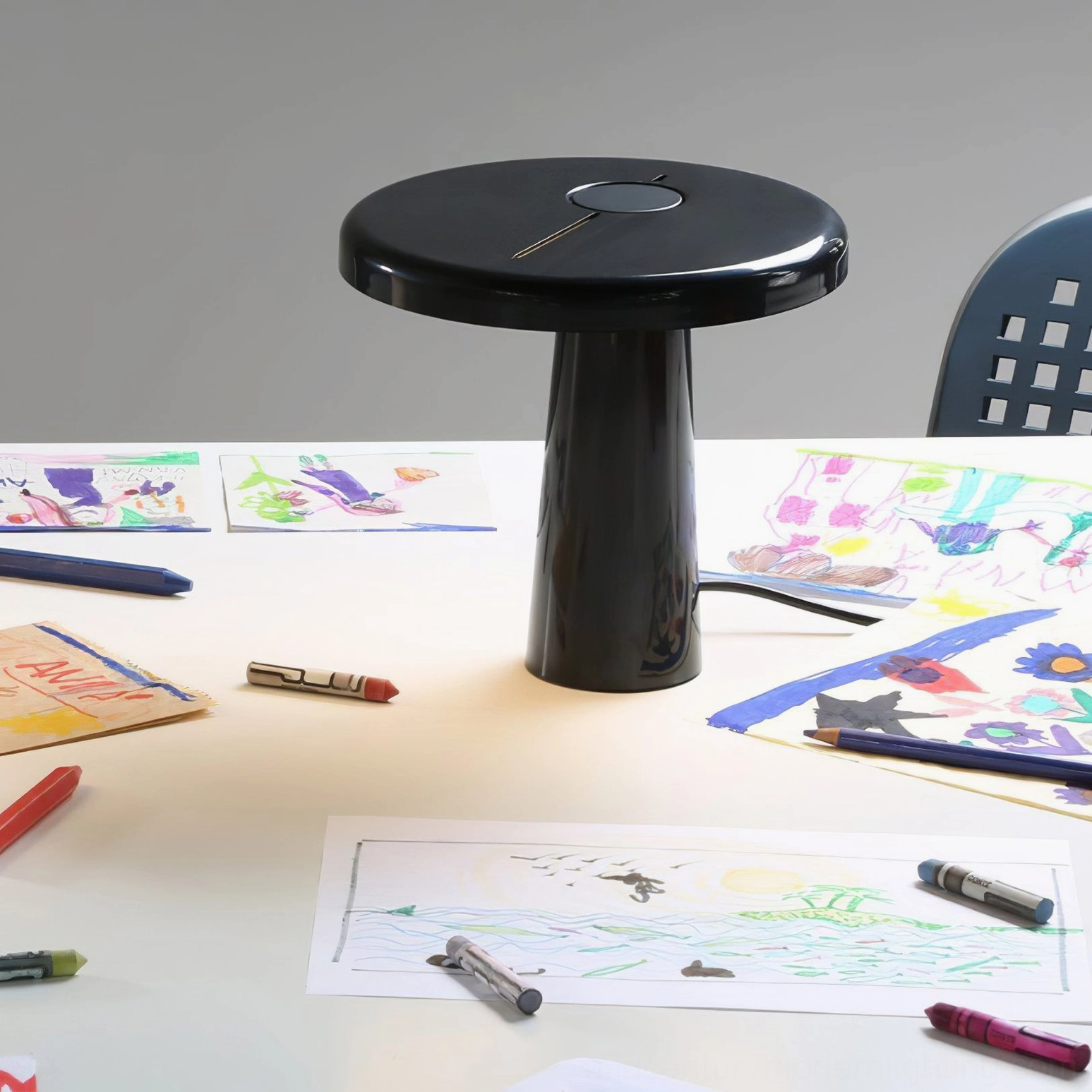 Overhead shot of Hoop LED table lamp on drafting desk with art supplies, creative workspace minimalist
