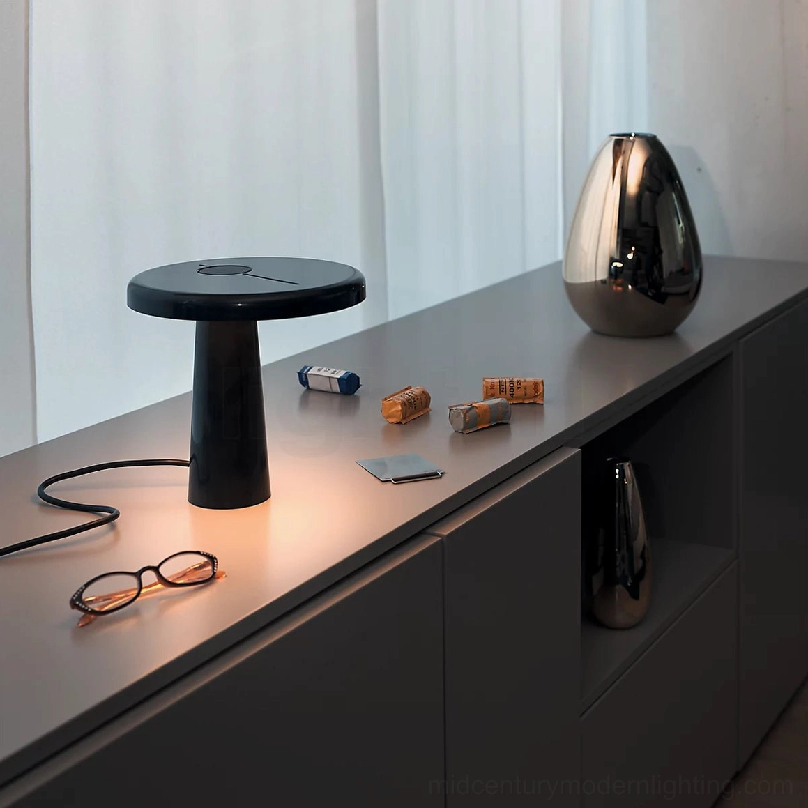Hoop LED table lamp in matte black on sideboard cabinet with decorative objects, contemporary interior styling