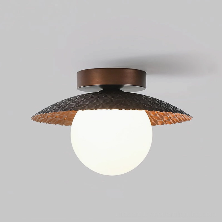 Hooper ceiling lamp three-quarter angle view displaying geometric form and textured metal surface finish composition