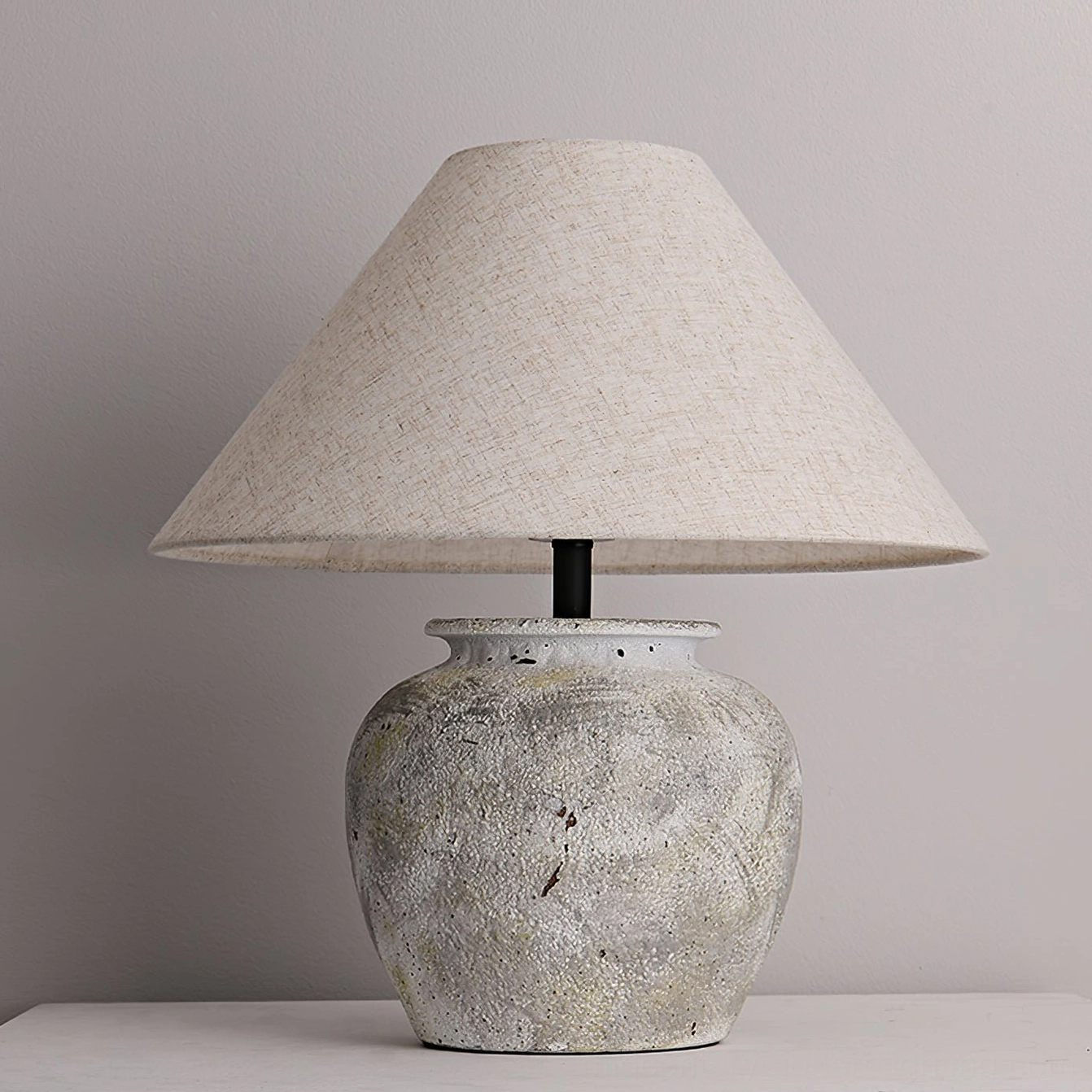 Houa ceramic table lamp illuminated with warm soft light - studio tabletop display