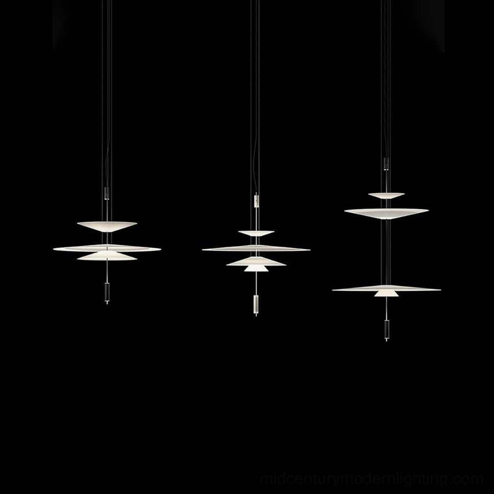 Hover Disc pendant in contemporary dining space with modern table and neutral interior palette