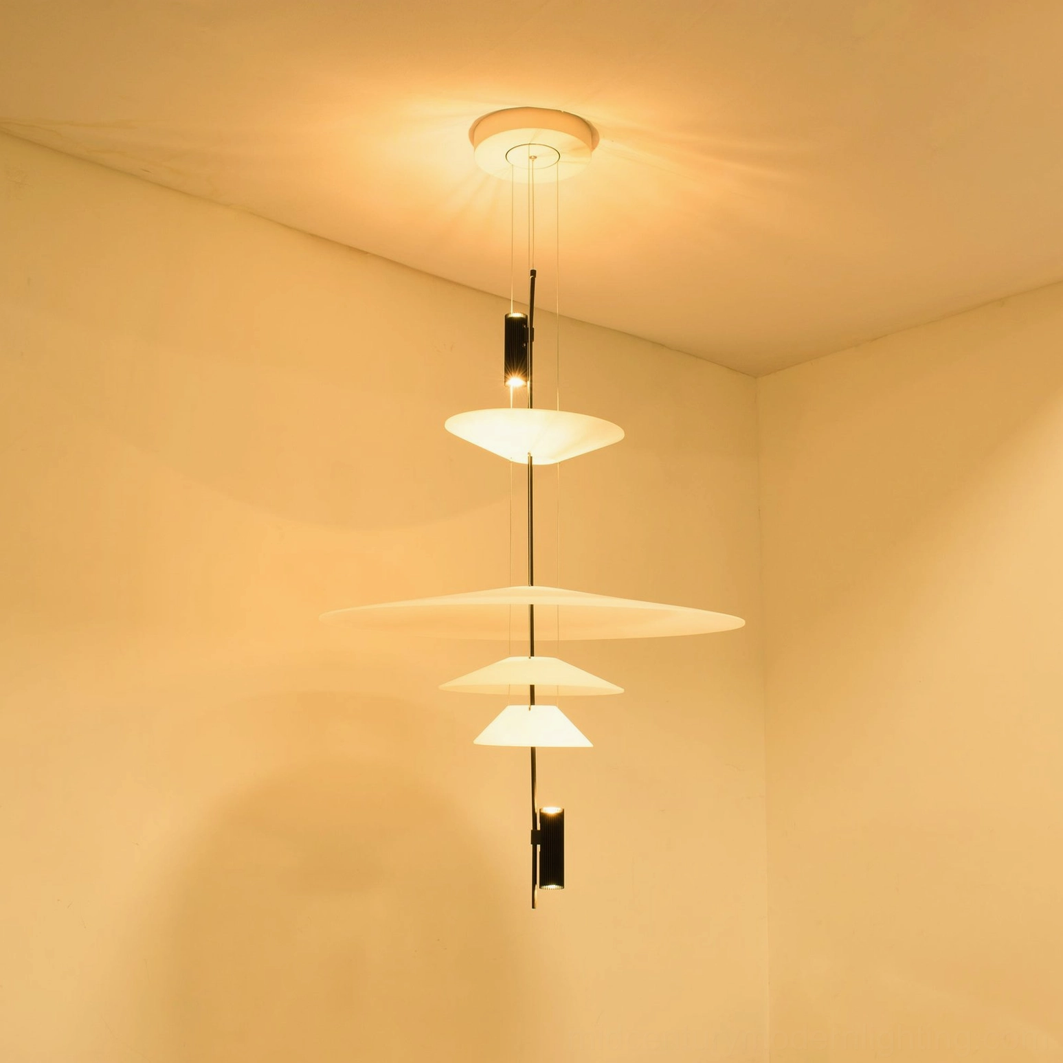 Modern Hover Disc pendant in contemporary entryway with polished metal hardware and clean lines