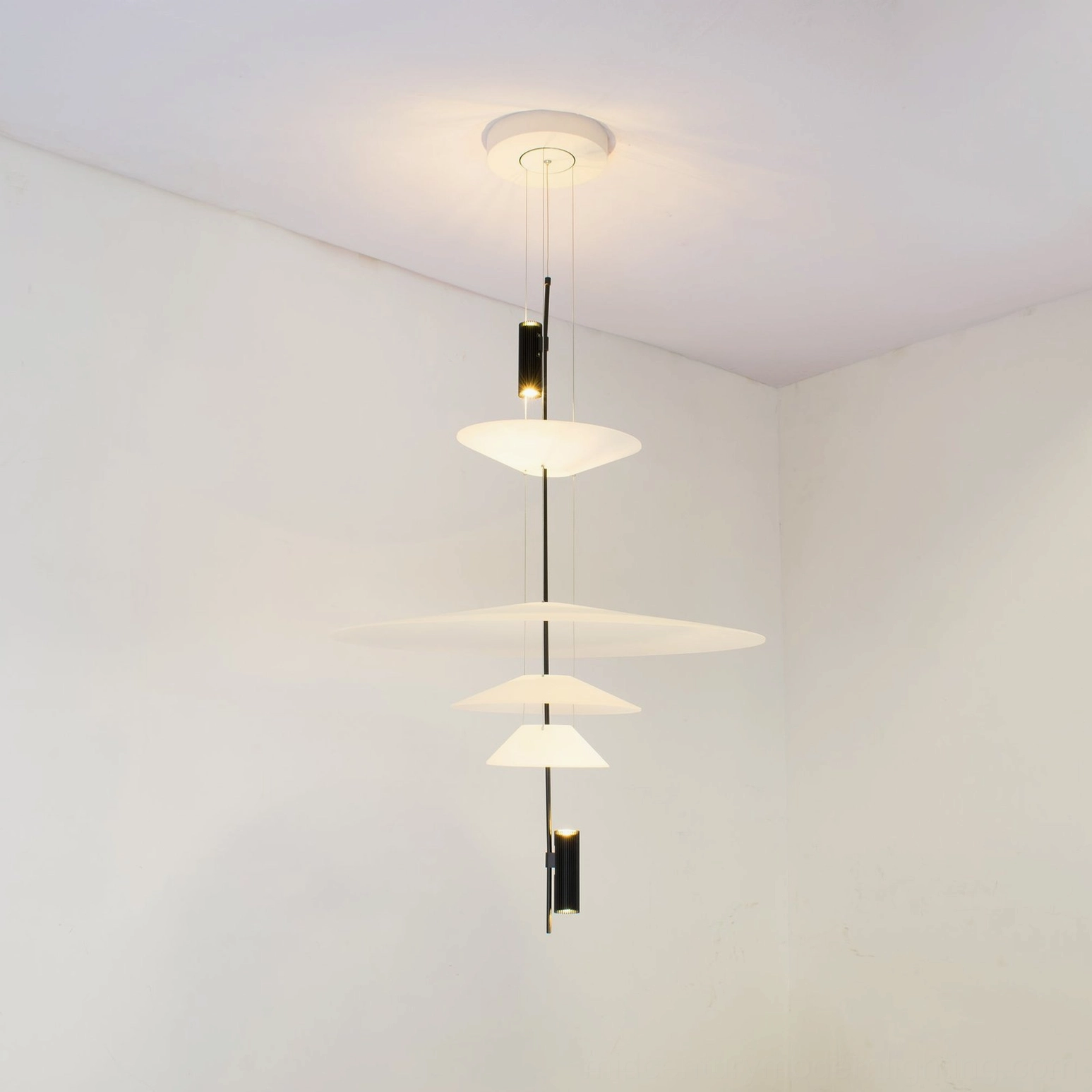 Front view of Hover Disc chandelier with double white disc shades and black metal cable suspension system