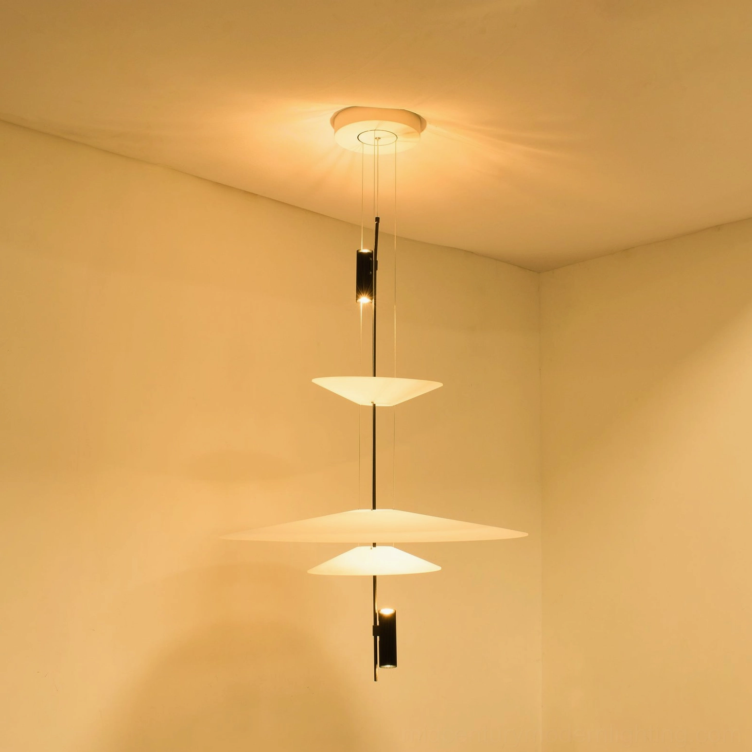 Hover Disc pendant with integrated LED casting soft diffused light downward through lower disc