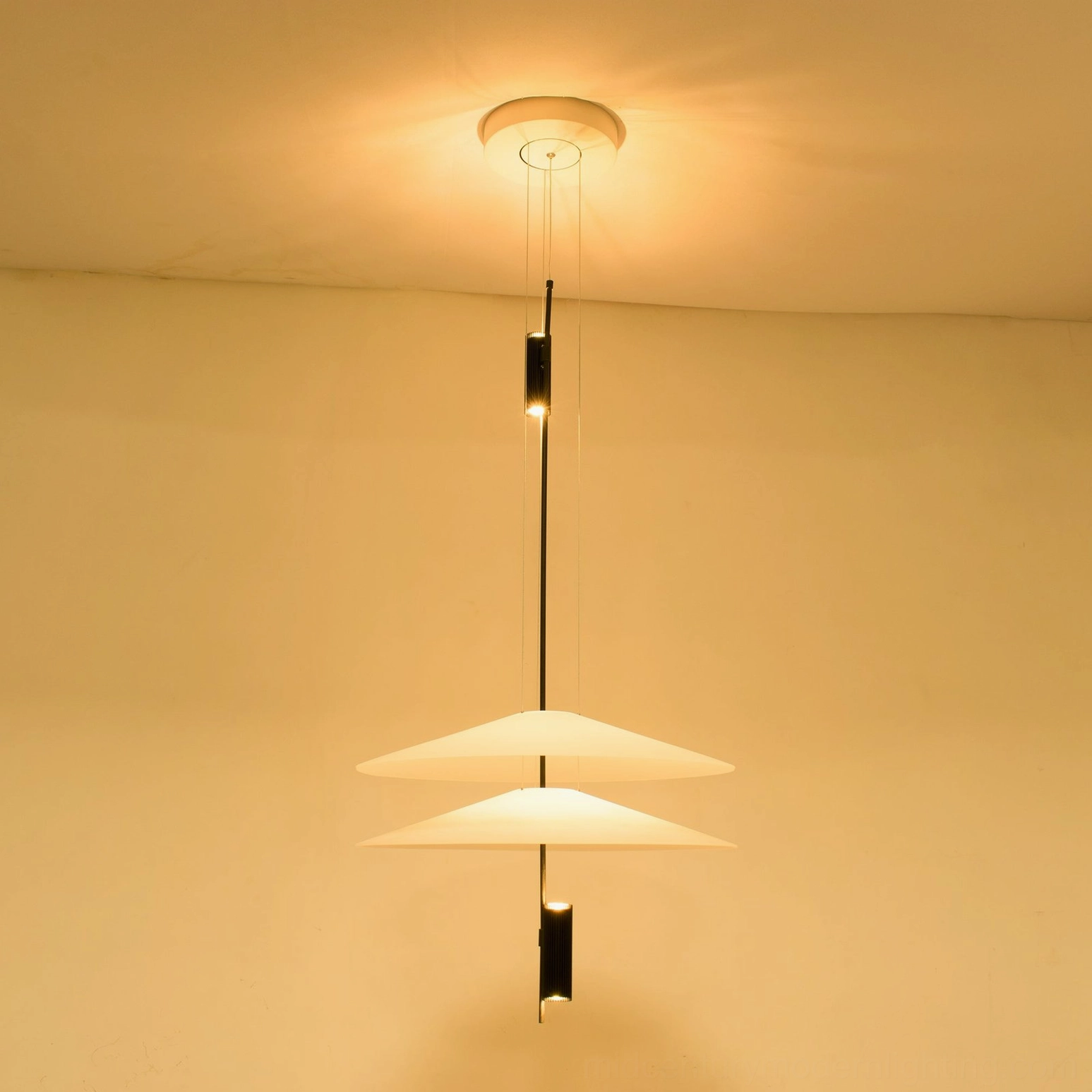 Hover Disc pendant chandelier styled in modern kitchen island setting with sleek cabinetry