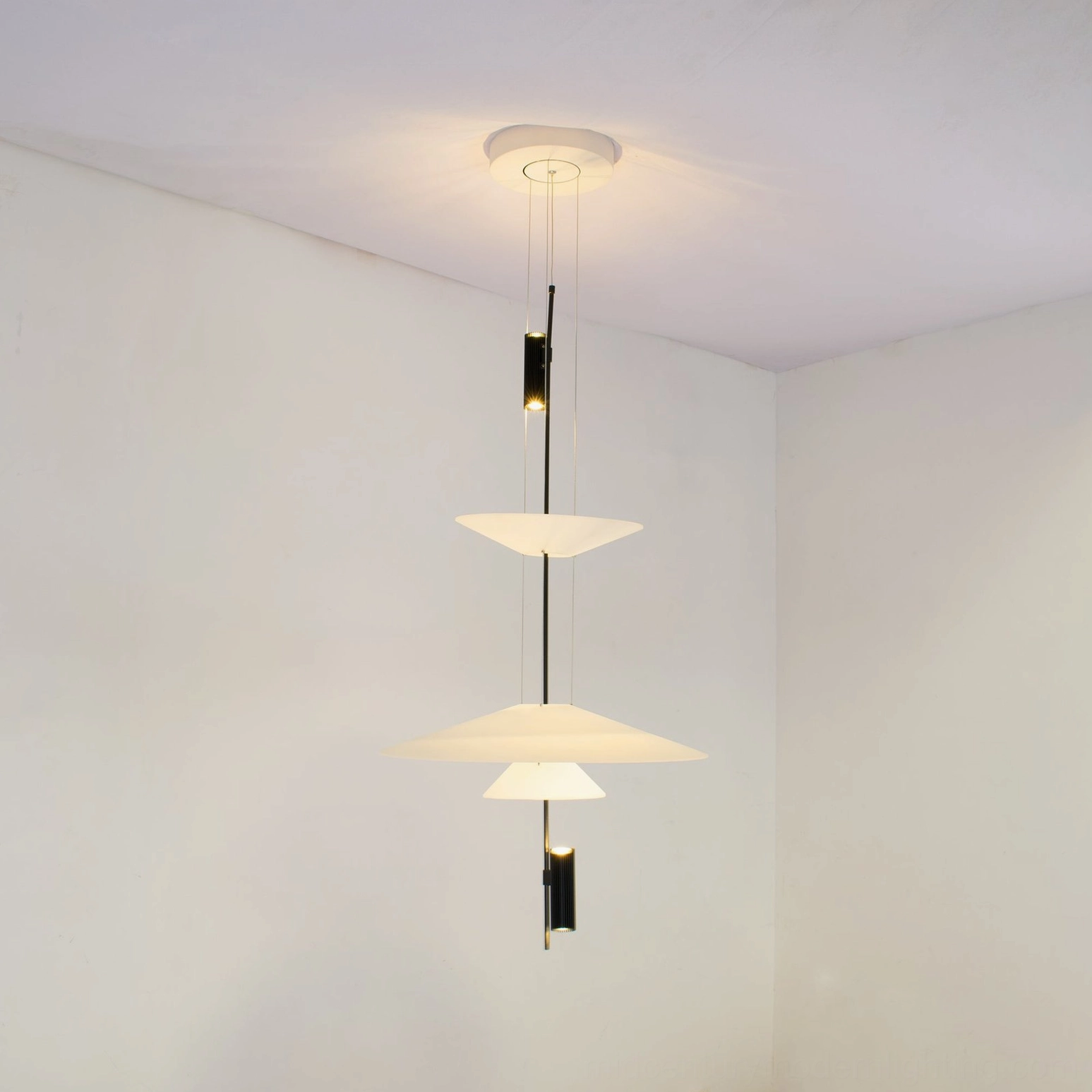 Modern Hover Disc chandelier detail shot showcasing translucent PMMA acrylic and steel cable construction