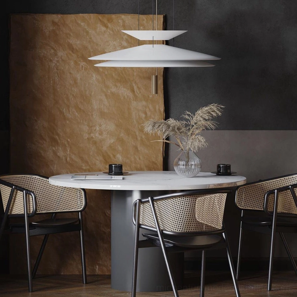 Modern Hover Disc pendant lighting over wood dining table in open-plan living space with minimalist interior design