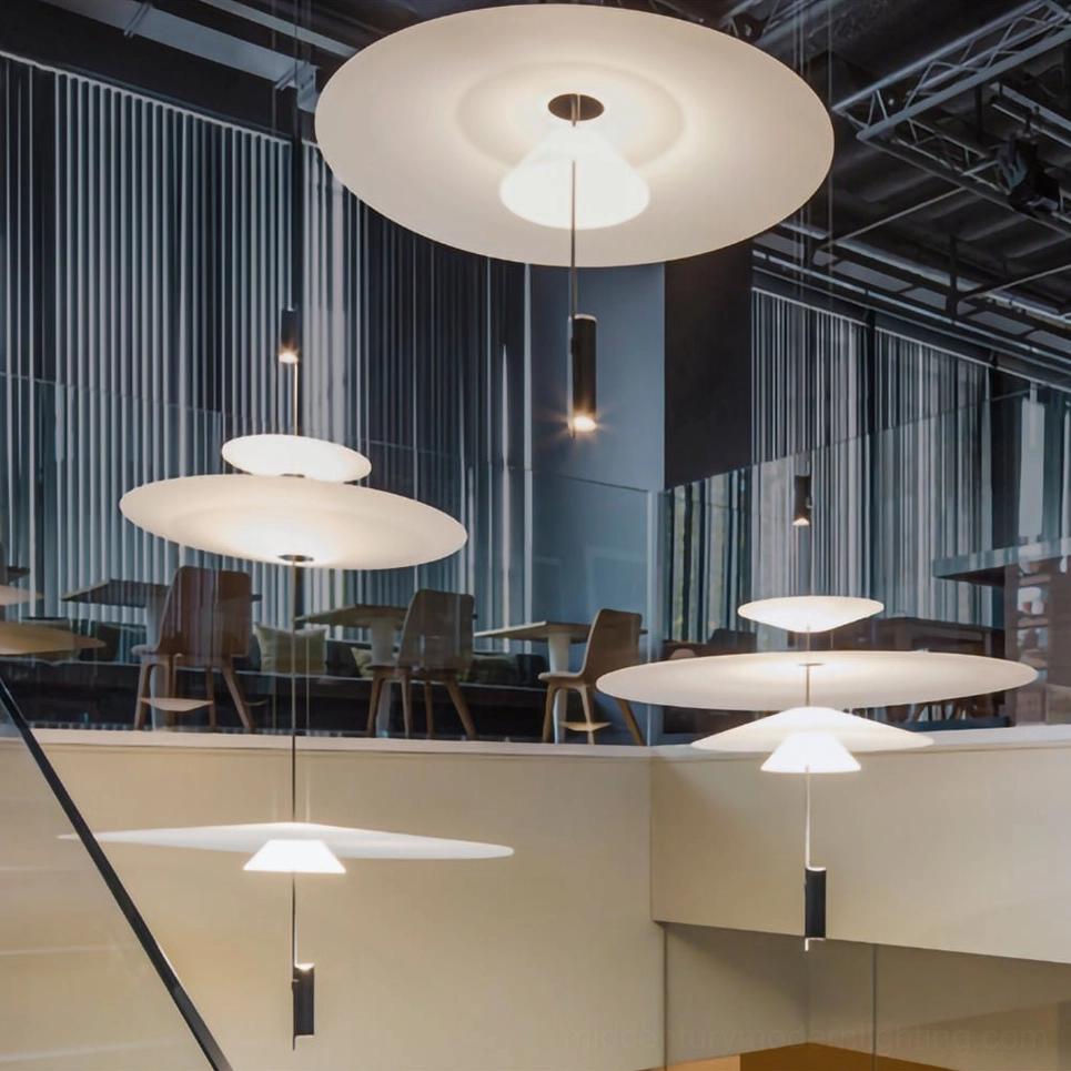 Multiple Hover Disc pendants in coordinated arrangement demonstrating versatility and scale options
