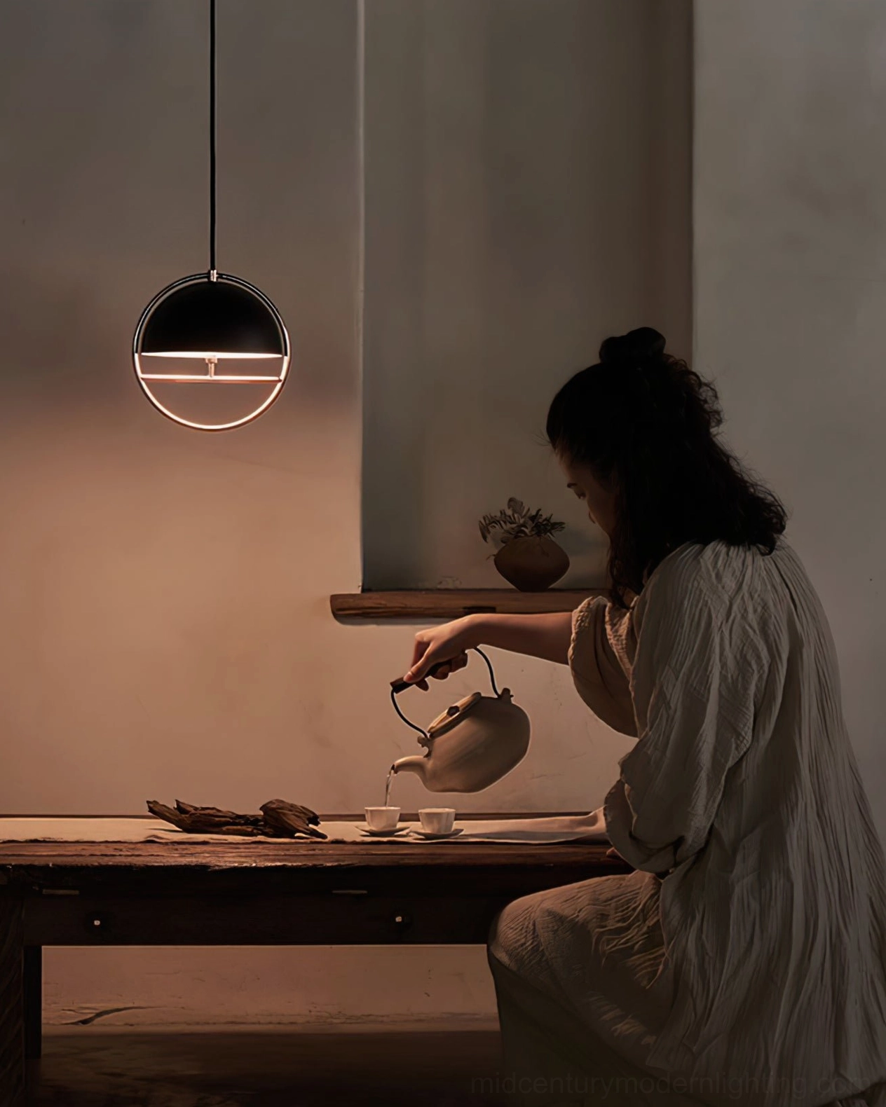Huan pendant light in living room environment demonstrating home styling and decor integration