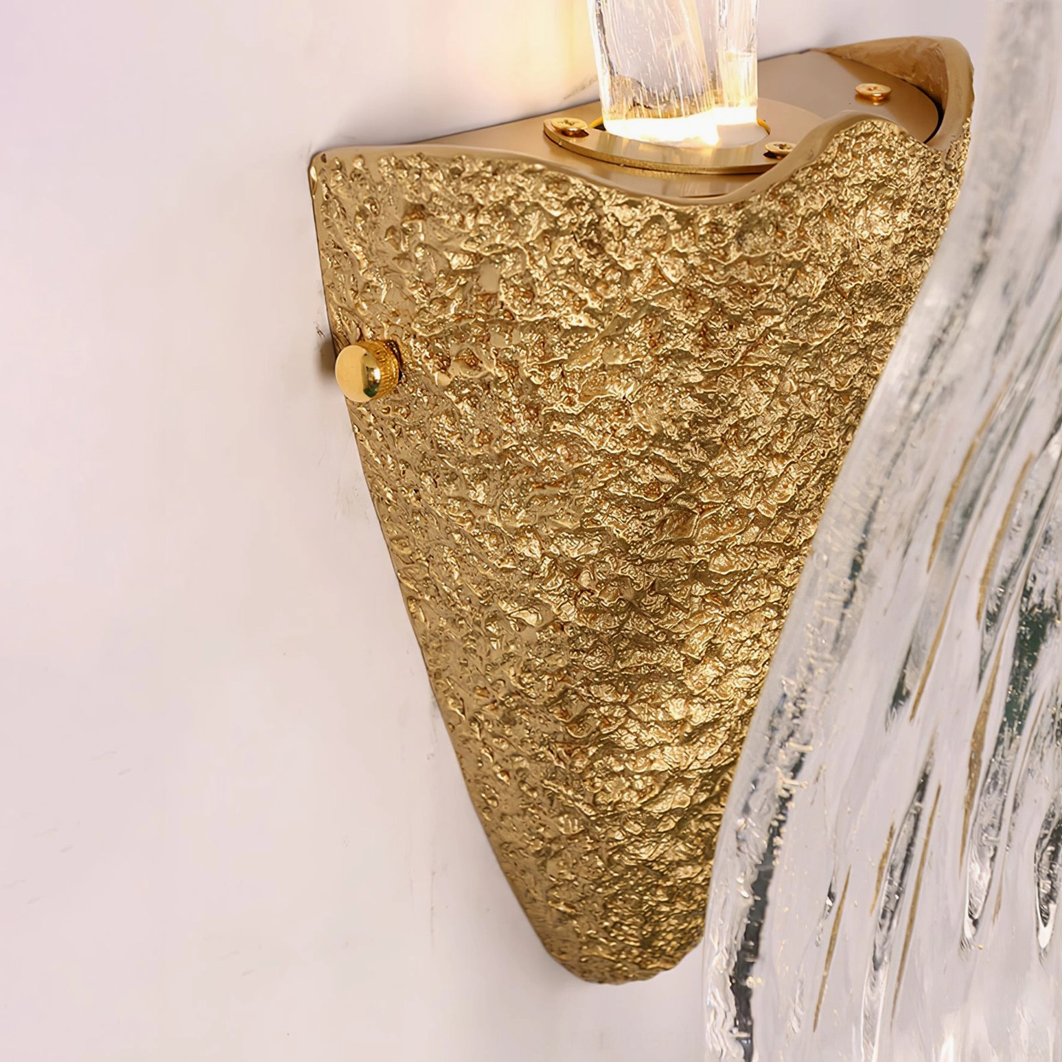 Icarus glass wall sconce modern bedroom setting creating dramatic focal point lighting