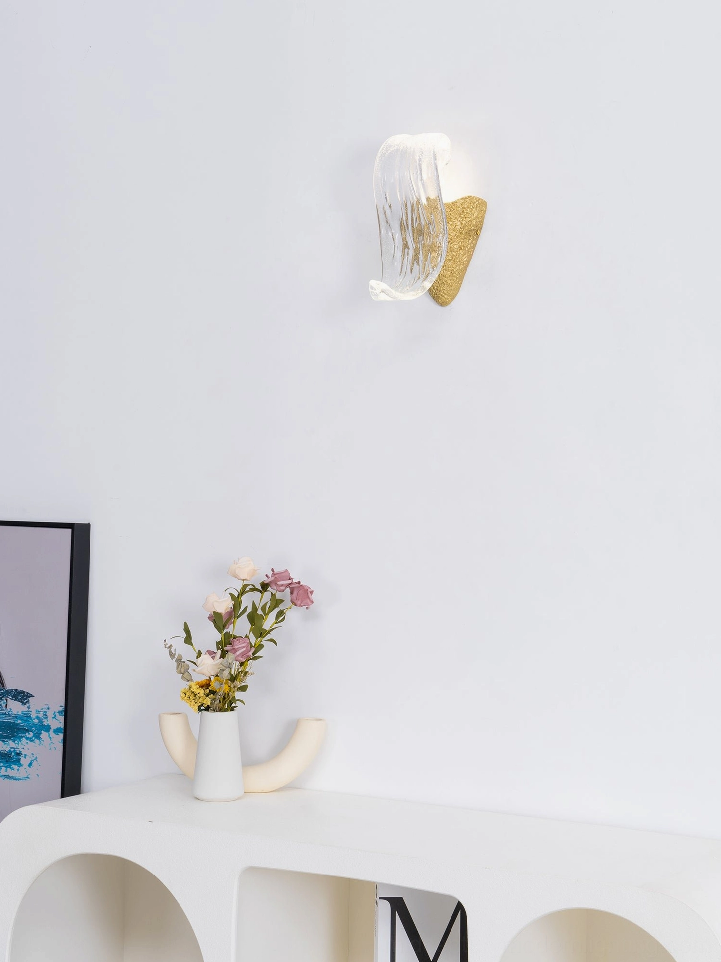 Icarus sculptural wall lamp detail view emphasizing handcrafted glass craftsmanship