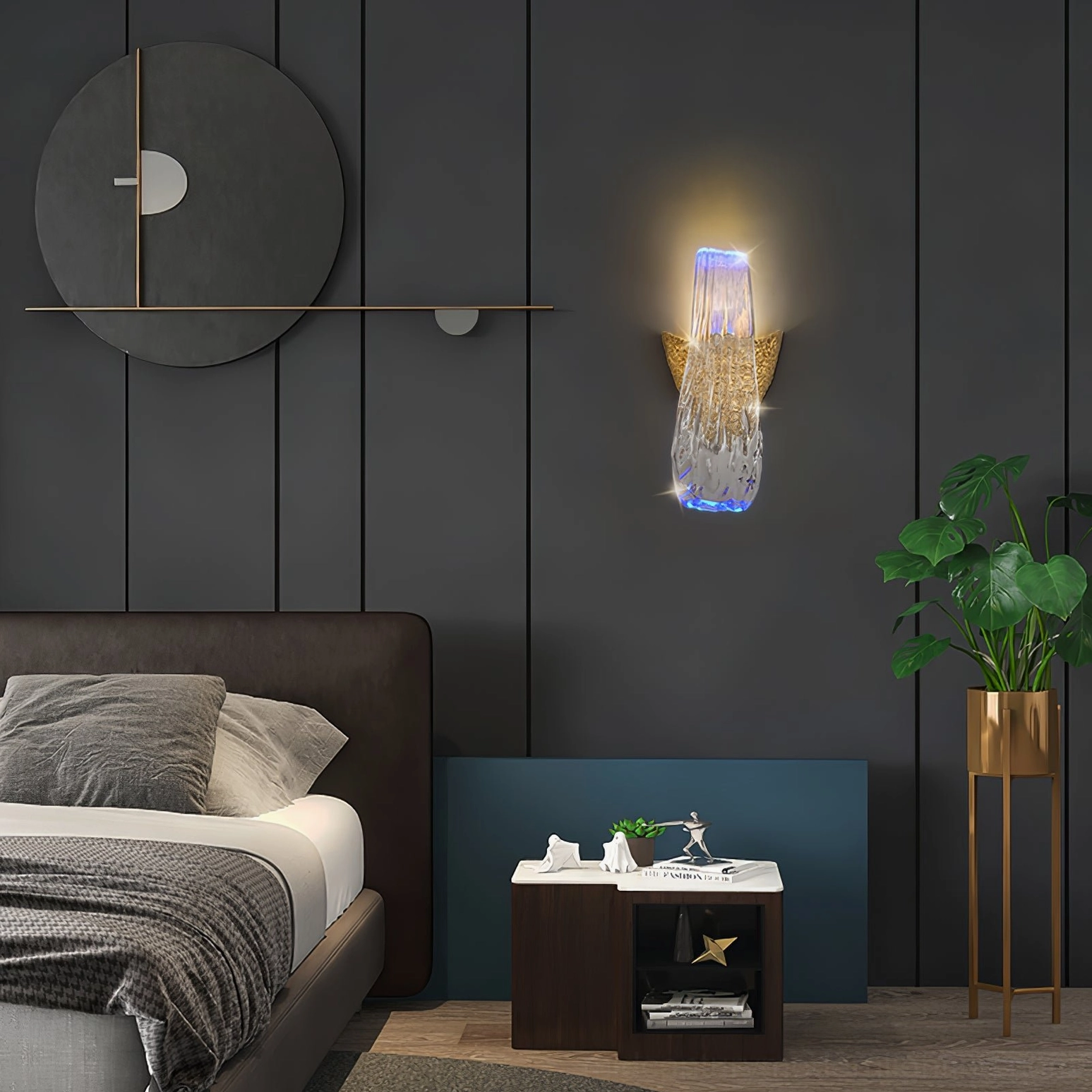 Icarus wall lamp illuminated showing warm glow through handcrafted crystal glass