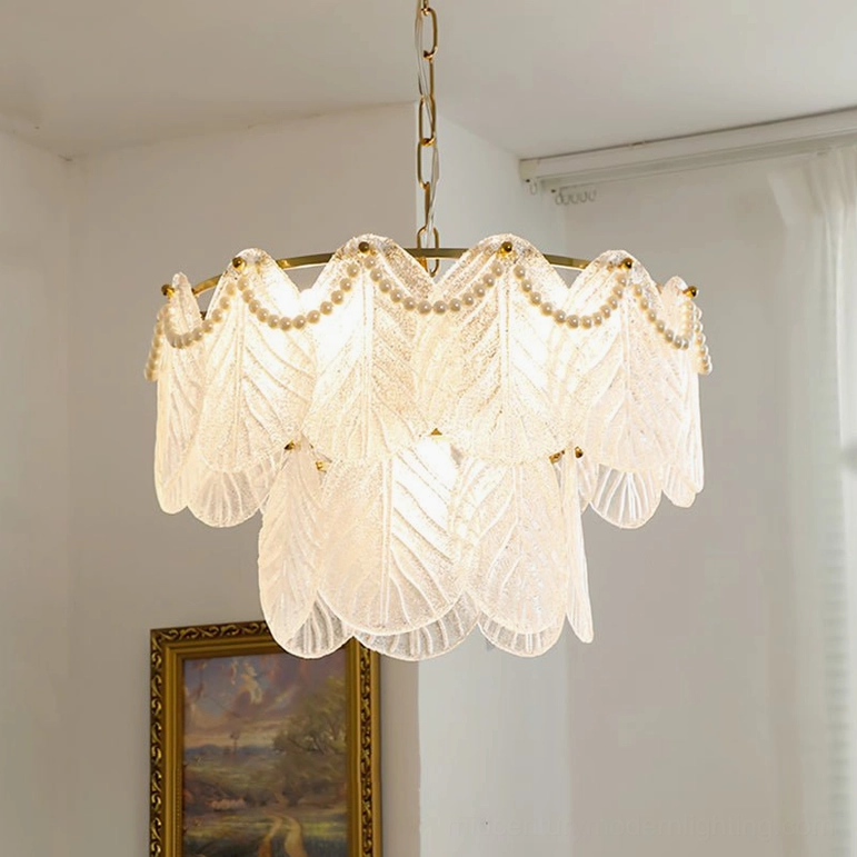 Illuminated frosted glass leaf tiered pendant lamp creating warm romantic ambiance with brass hardware details, cozy vintage-inspired home lighting