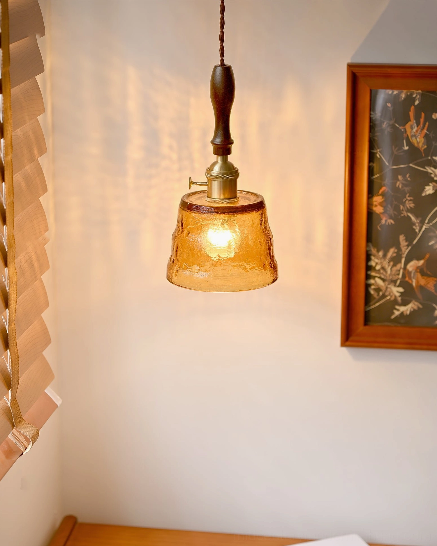 Jace mid-century modern pendant lighting fixture creating warm ambient glow in corner space