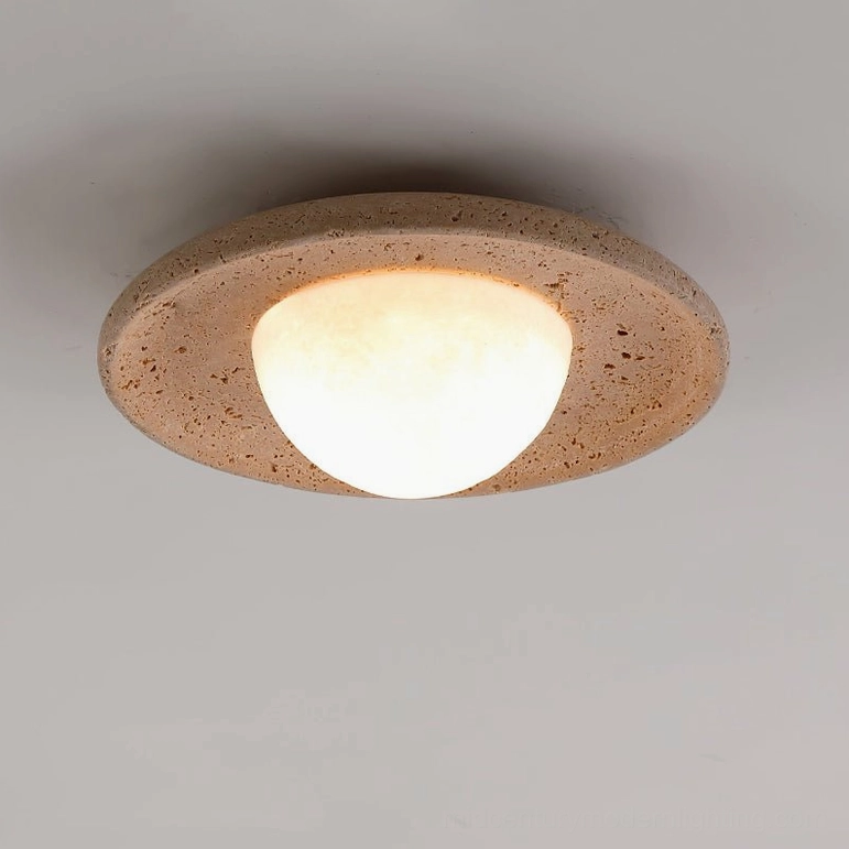 Jenny travertine ceiling light detailed close-up showing frosted dome diffuser and textured travertine rim finish