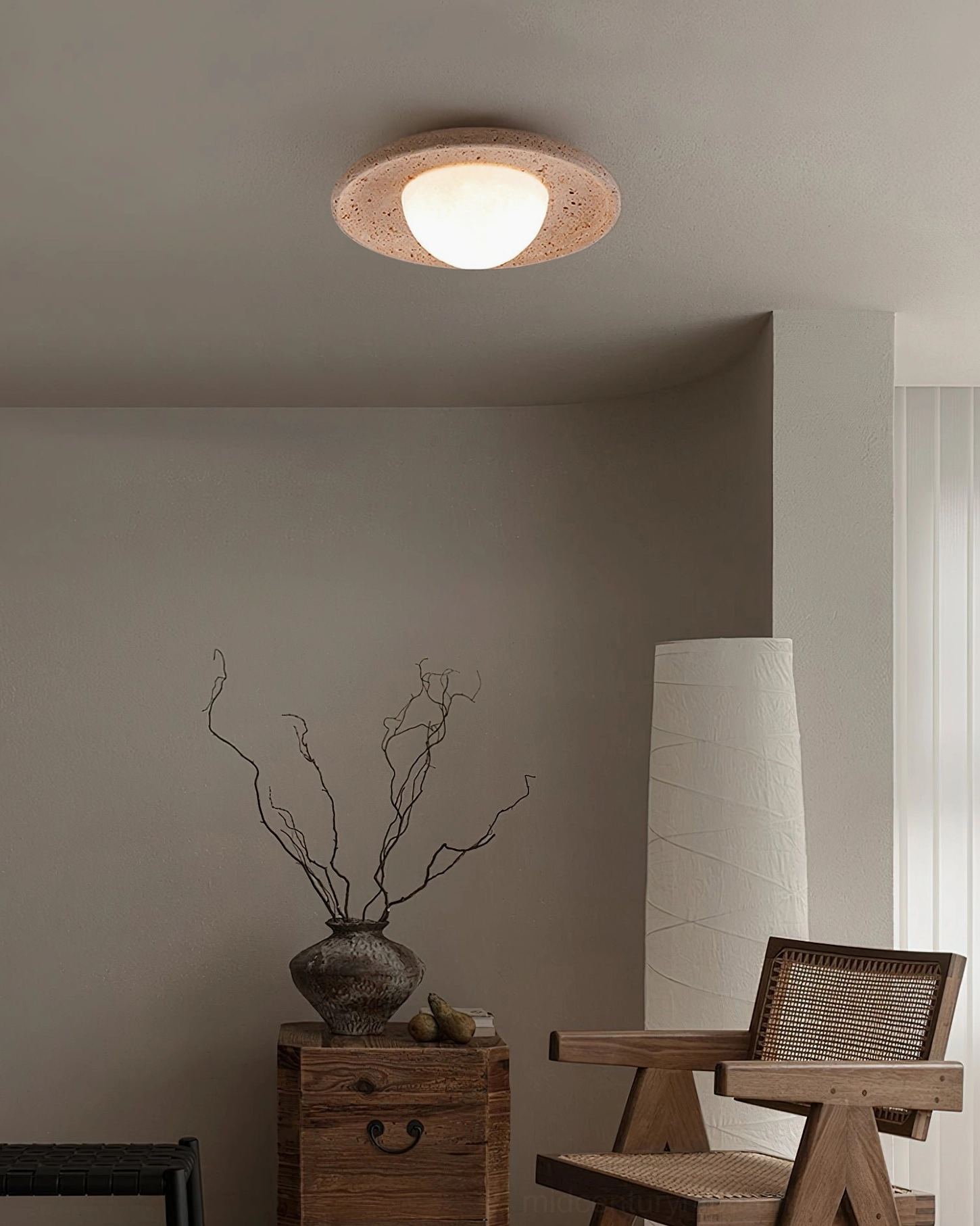 Jenny natural travertine ceiling light in wabi-sabi sitting corner with neutral organic home decor