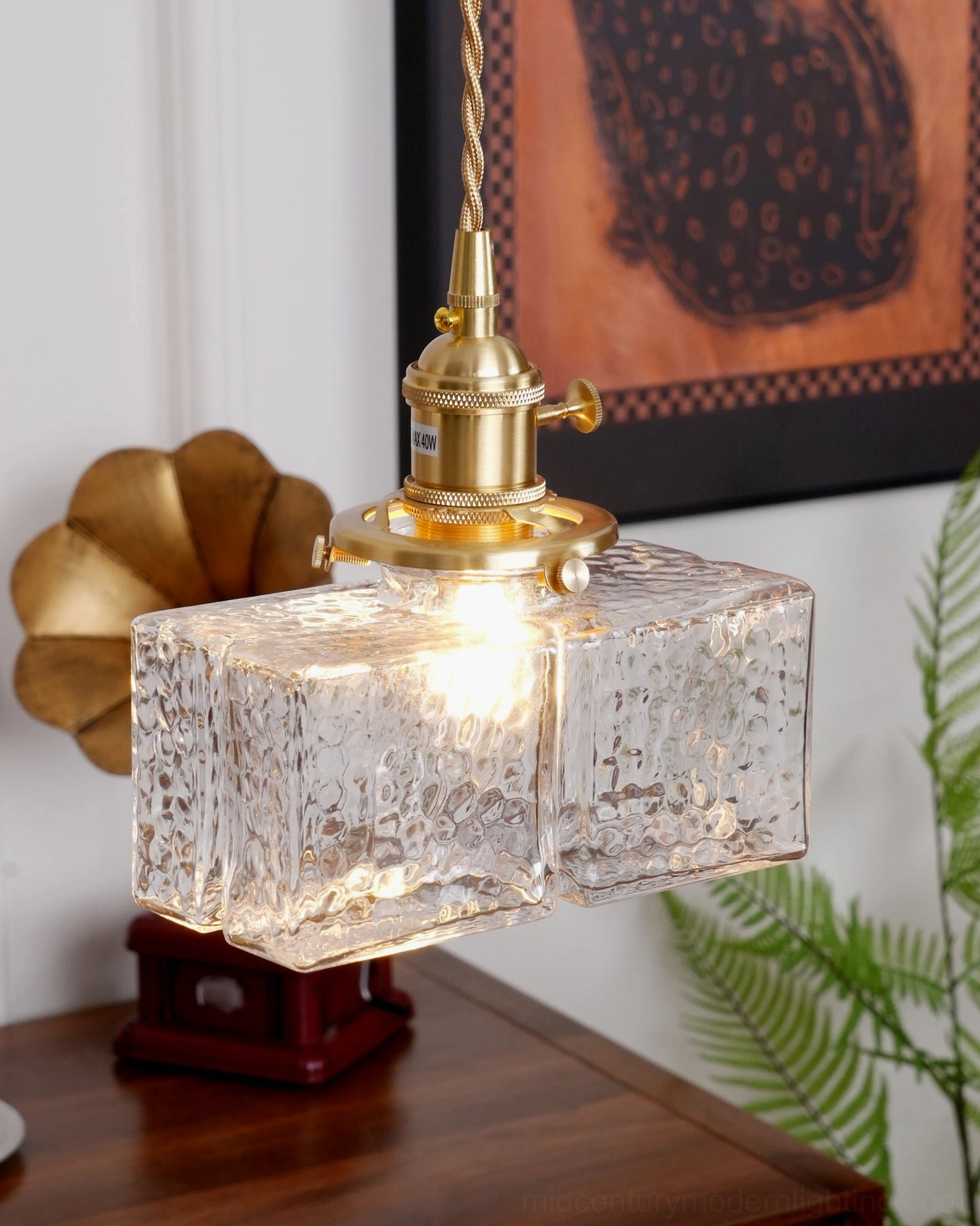Jewel brass and clear glass pendant light shown in multiple scales and finishes - all three models displayed together