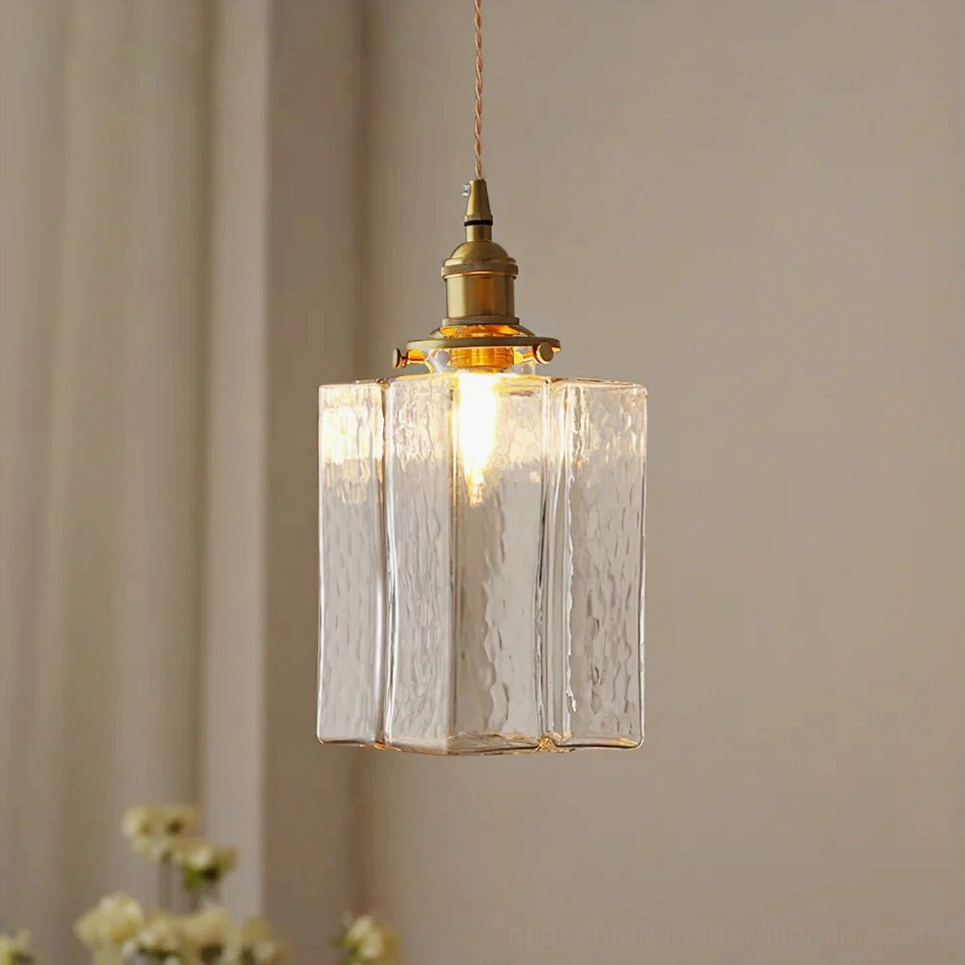 Jewel brass and clear glass pendant light - Model C tall tower design showcasing the tallest silhouette with hammered glass shade