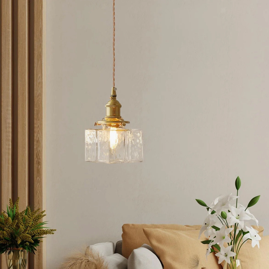 Jewel brass pendant light installed as single focal point accent fixture in contemporary interior space