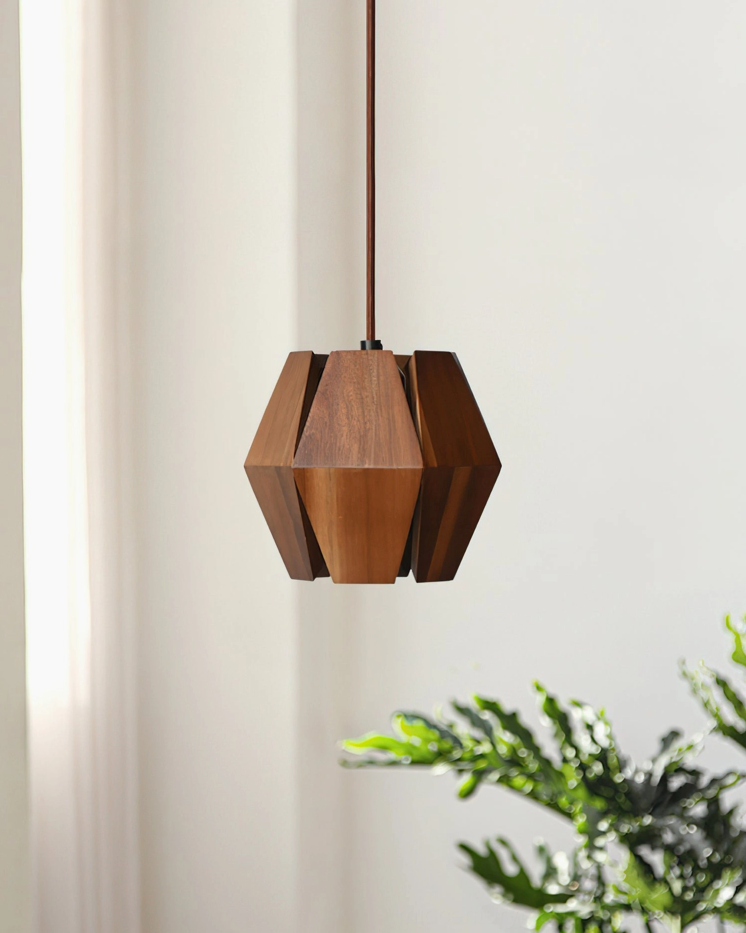 Kaden geometric wood pendant casting faceted shadow patterns creating ambient light atmosphere