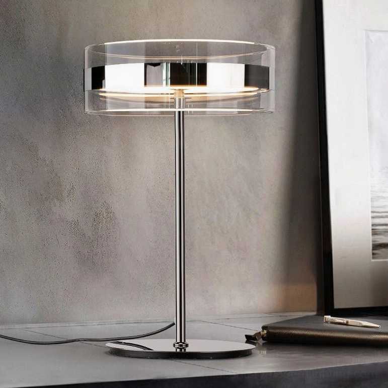 Modern cylindrical table lamp in home office desk setting, three-quarter perspective with warm LED light