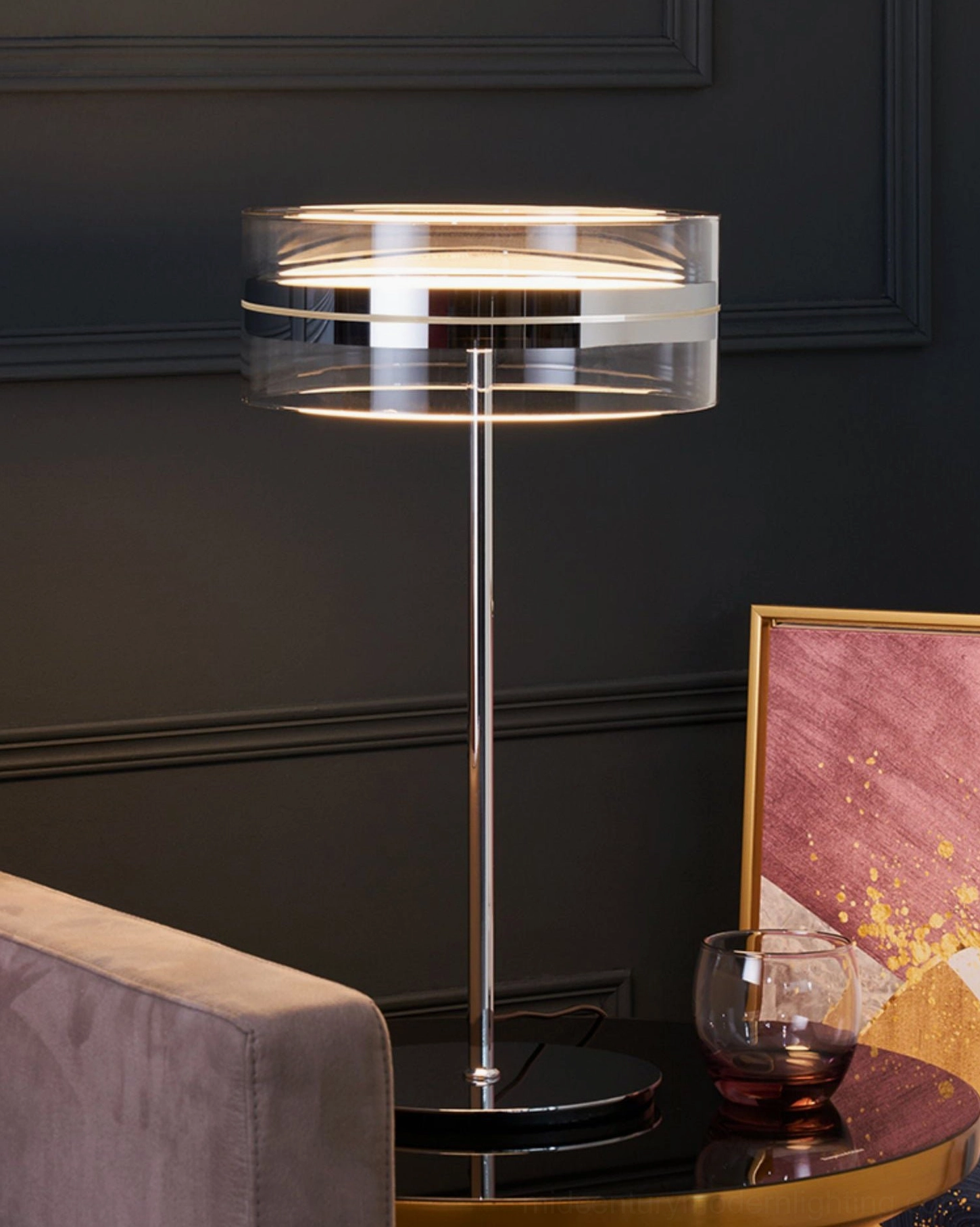 Luxury lounge table lamp with dual-layer acrylic shade, dark accent wall background, warm lighting ambiance