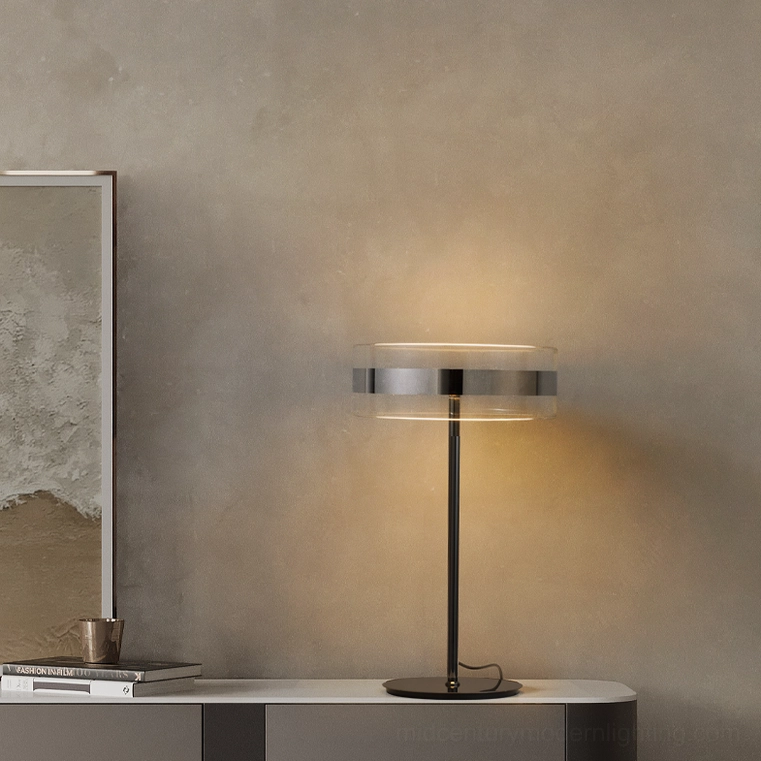 Contemporary table lamp on living room console with ambient warm glow, side angle view
