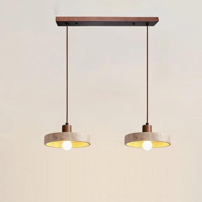 Two Kairi pendant lights in walnut wood finish suspended in modern dining room setting
