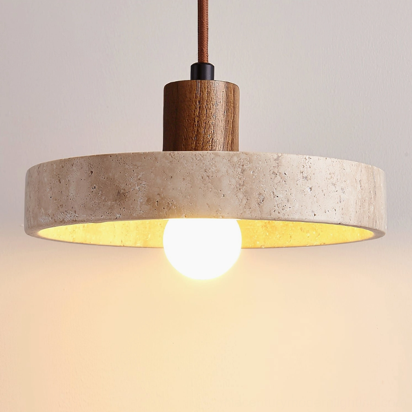 Kairi pendant light stone shade with natural porous travertine texture studio detail shot
