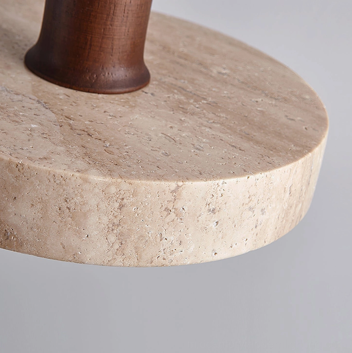 Close-up detail of Kairi pendant shade showing travertine stone texture and wooden cap construction
