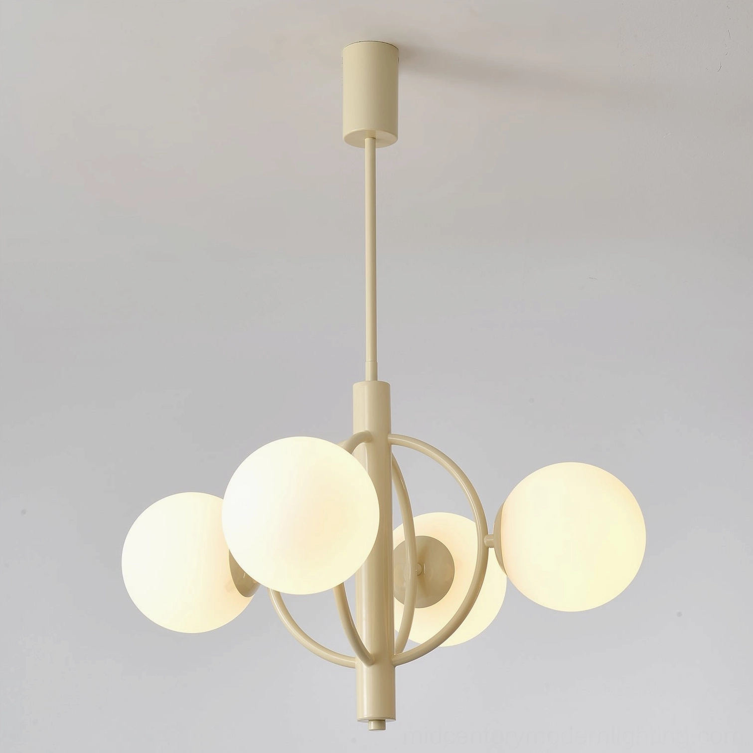 Kaiser 4-head chandelier showing partially illuminated frosted glass shades