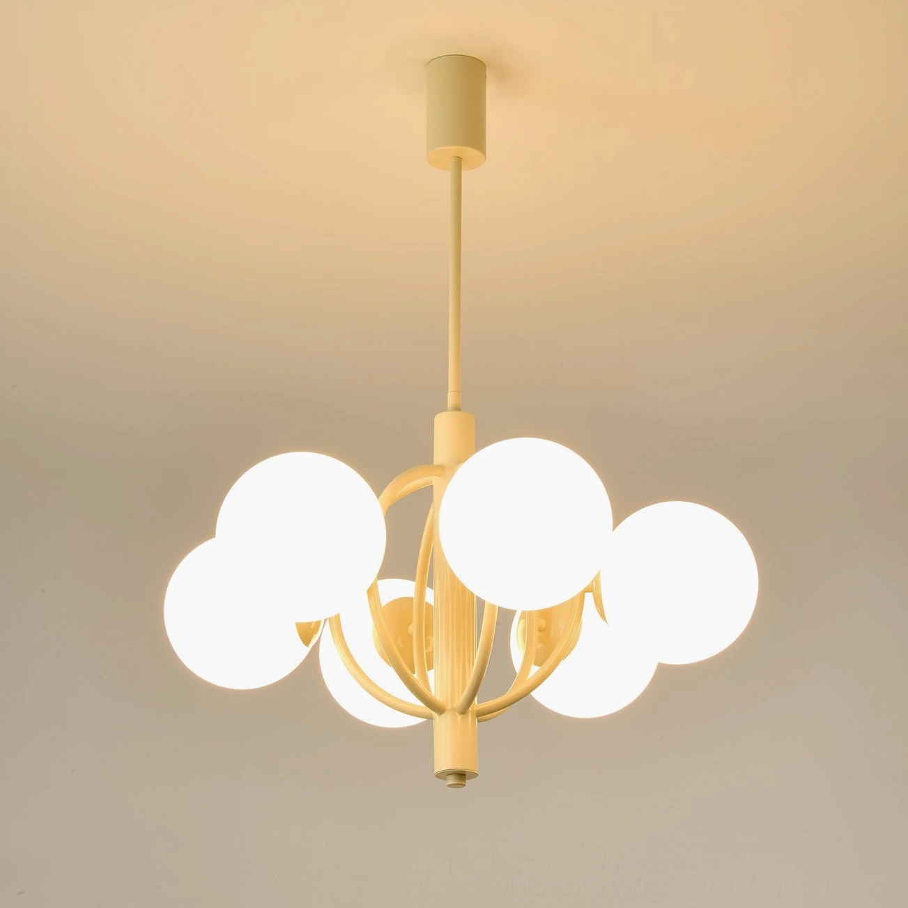 Kaiser 6-head chandelier interior installation with bright warm ambient ceiling lighting