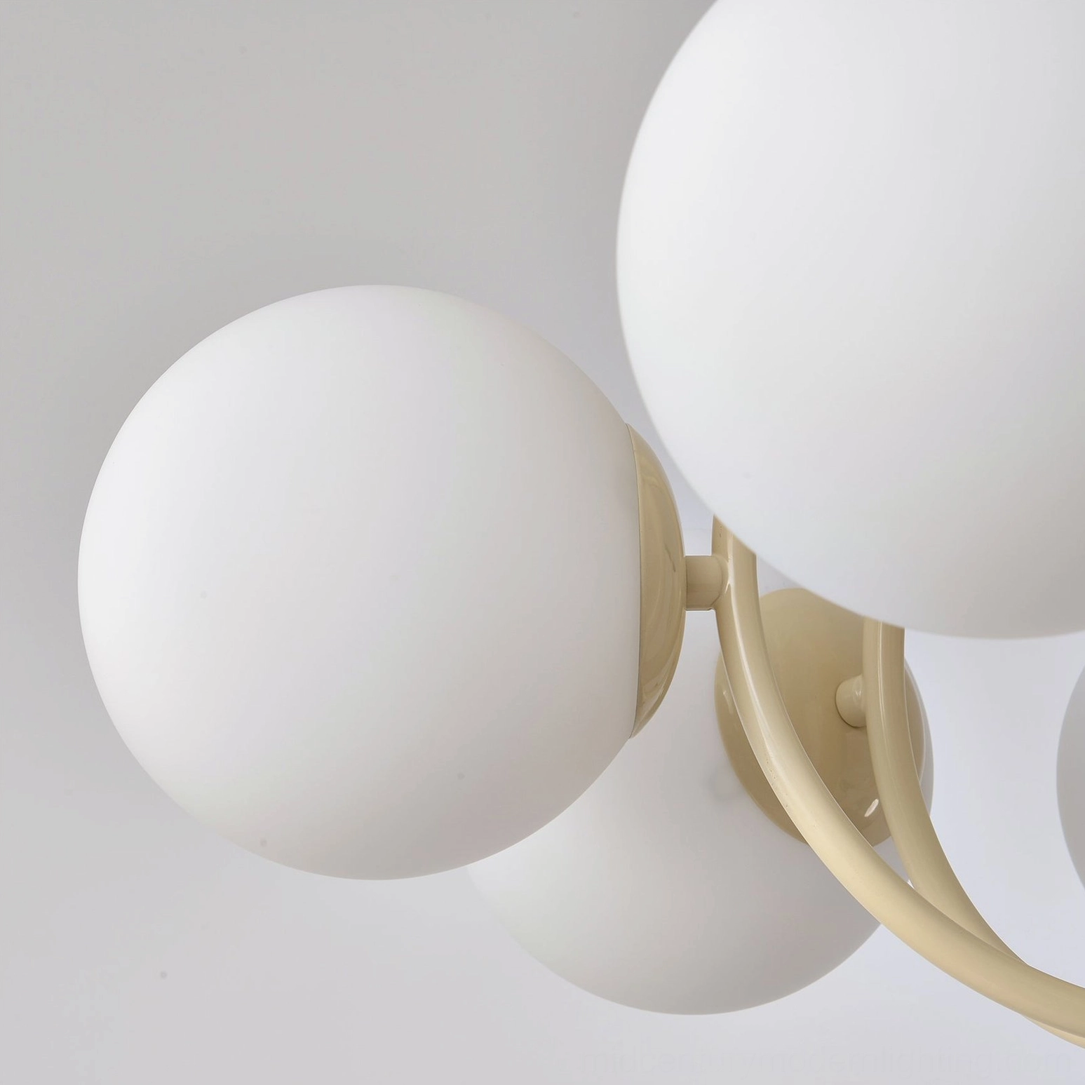 Close-up detail of Kaiser chandelier glass globes and metal hardware construction