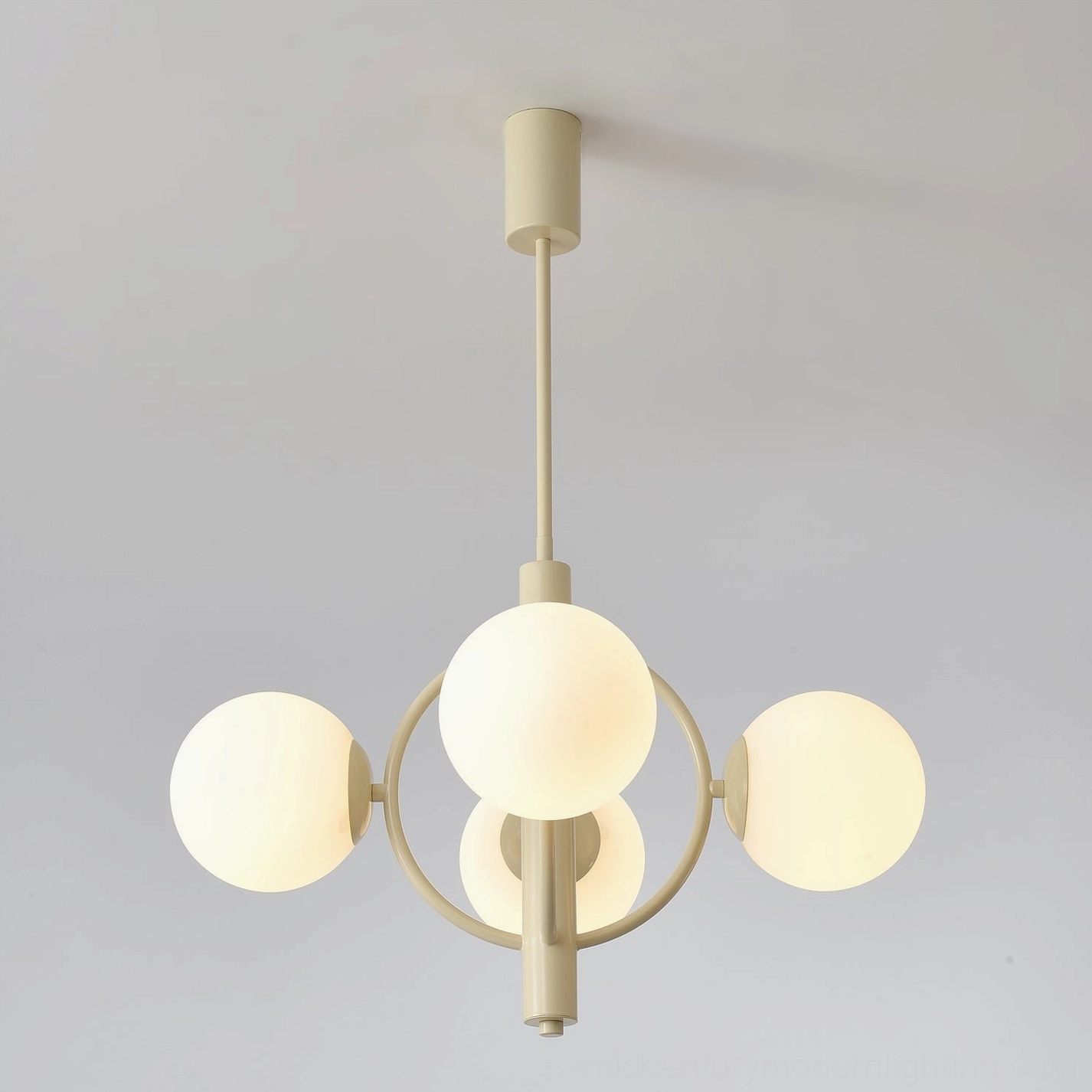 Kaiser mid-century modern chandelier showing elegant cream metal arms and glass globe diffusion