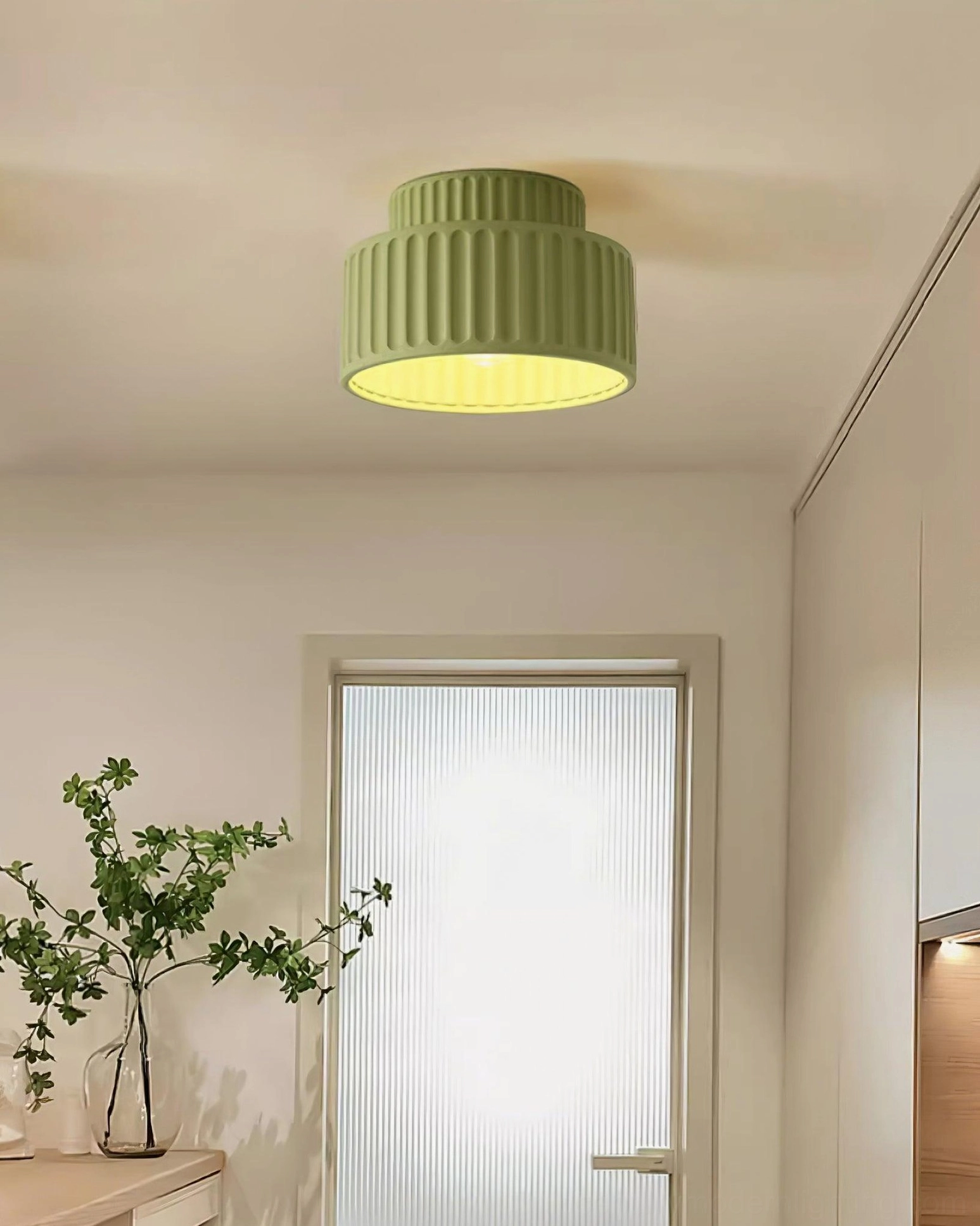 Kami ceiling lamp installed in contemporary bohemian bedroom with warm lighting and textile accents