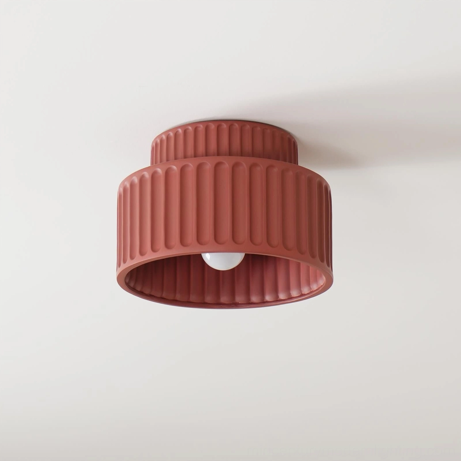 Kami two-tier ribbed ceiling lamp overhead view, white background, showing detailed fluted matte surface and round bulb base