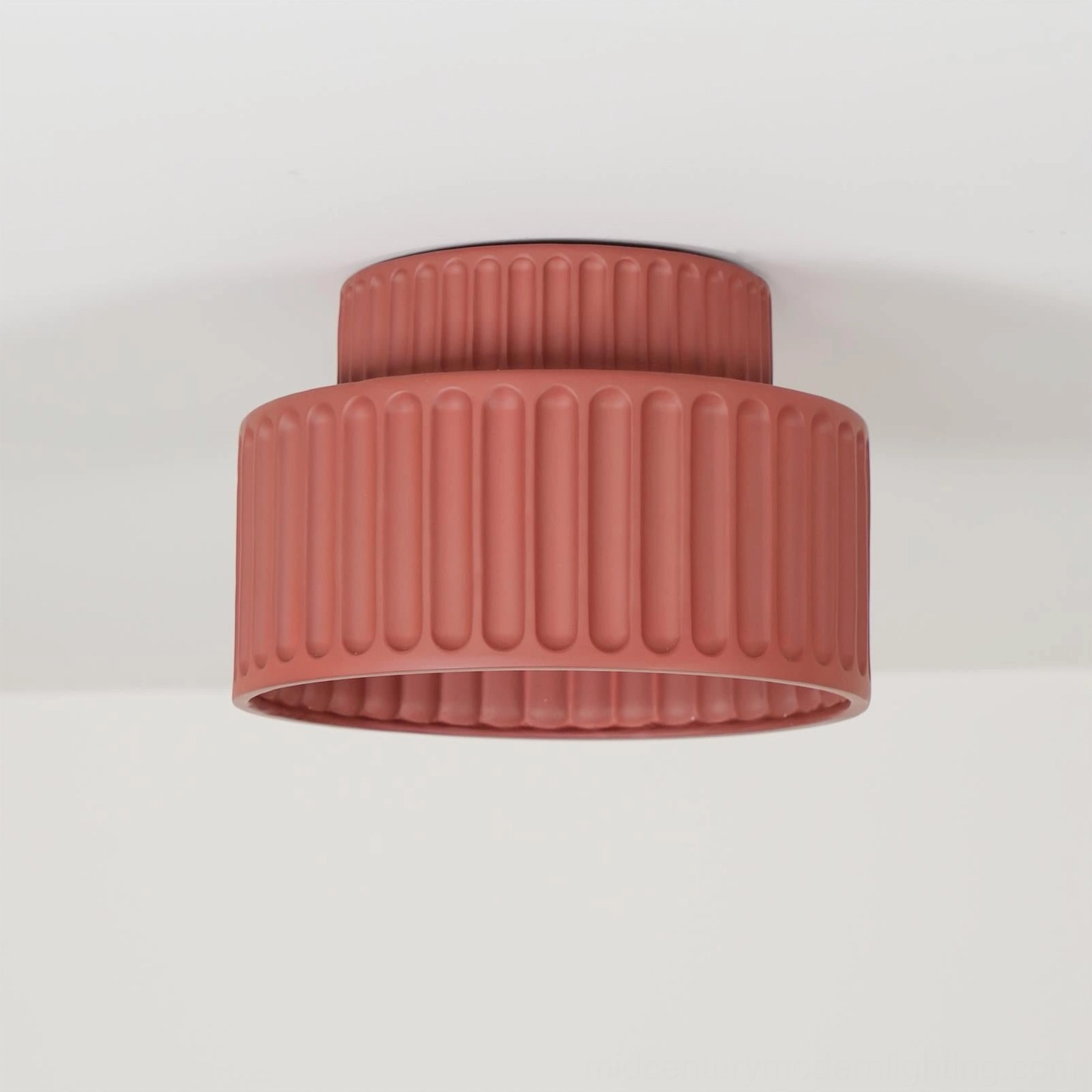 Kami ribbed ceiling lamp shadow detail showing dynamic light diffusion and matte surface character