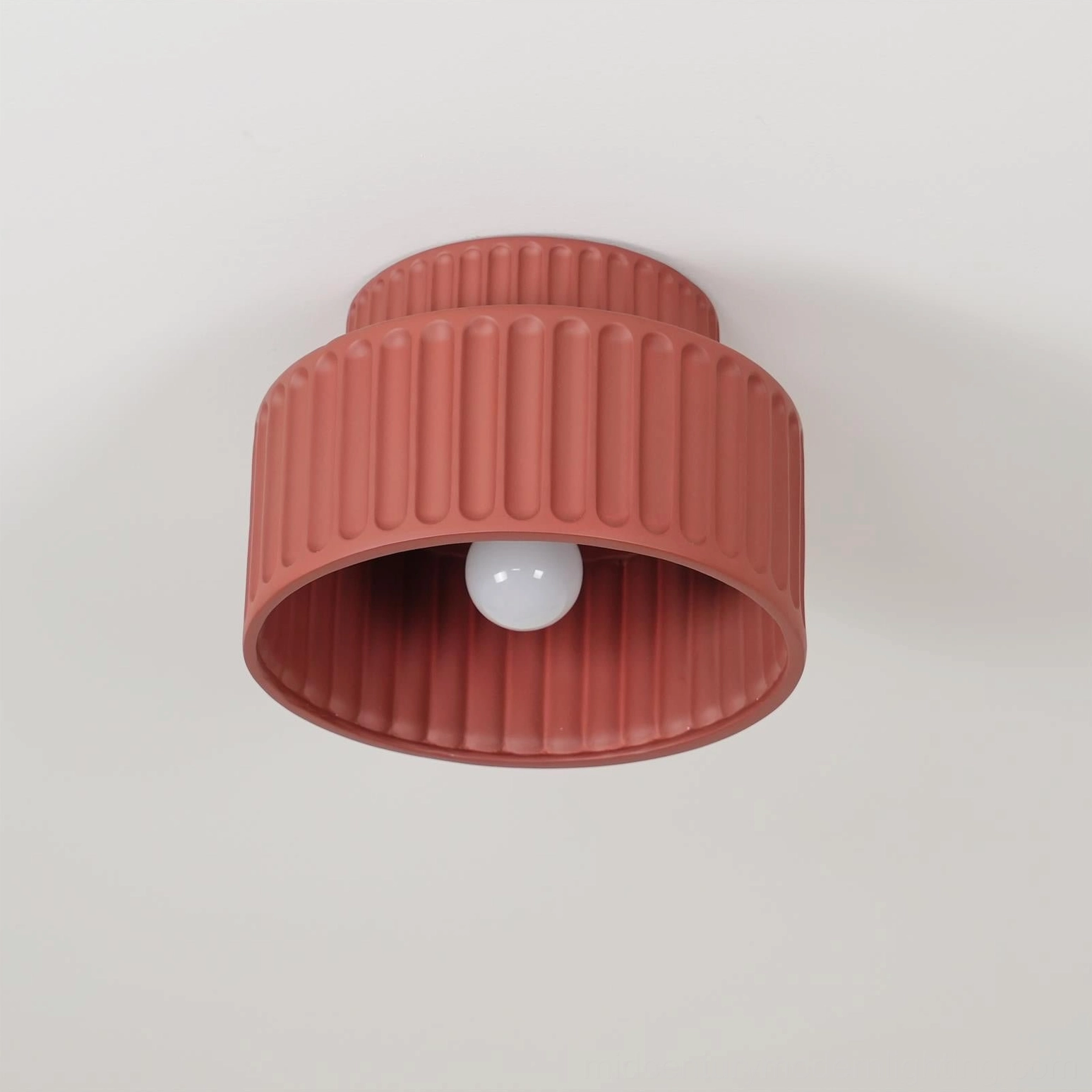 Kami ceiling lamp grouped display showing multiple finishes and design versatility in retail showroom setting
