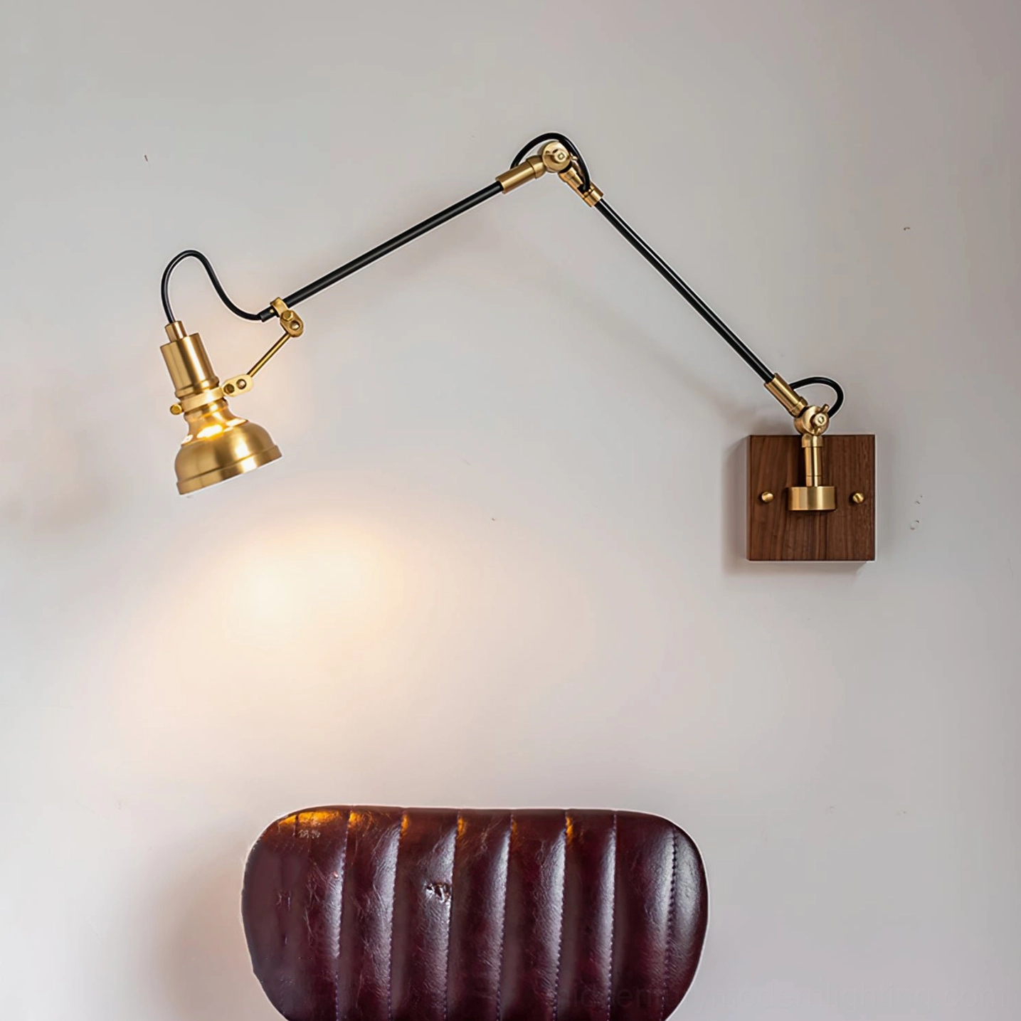Kane Swing Arm Wall Lamp angled view, brass dome shade and walnut backplate detail