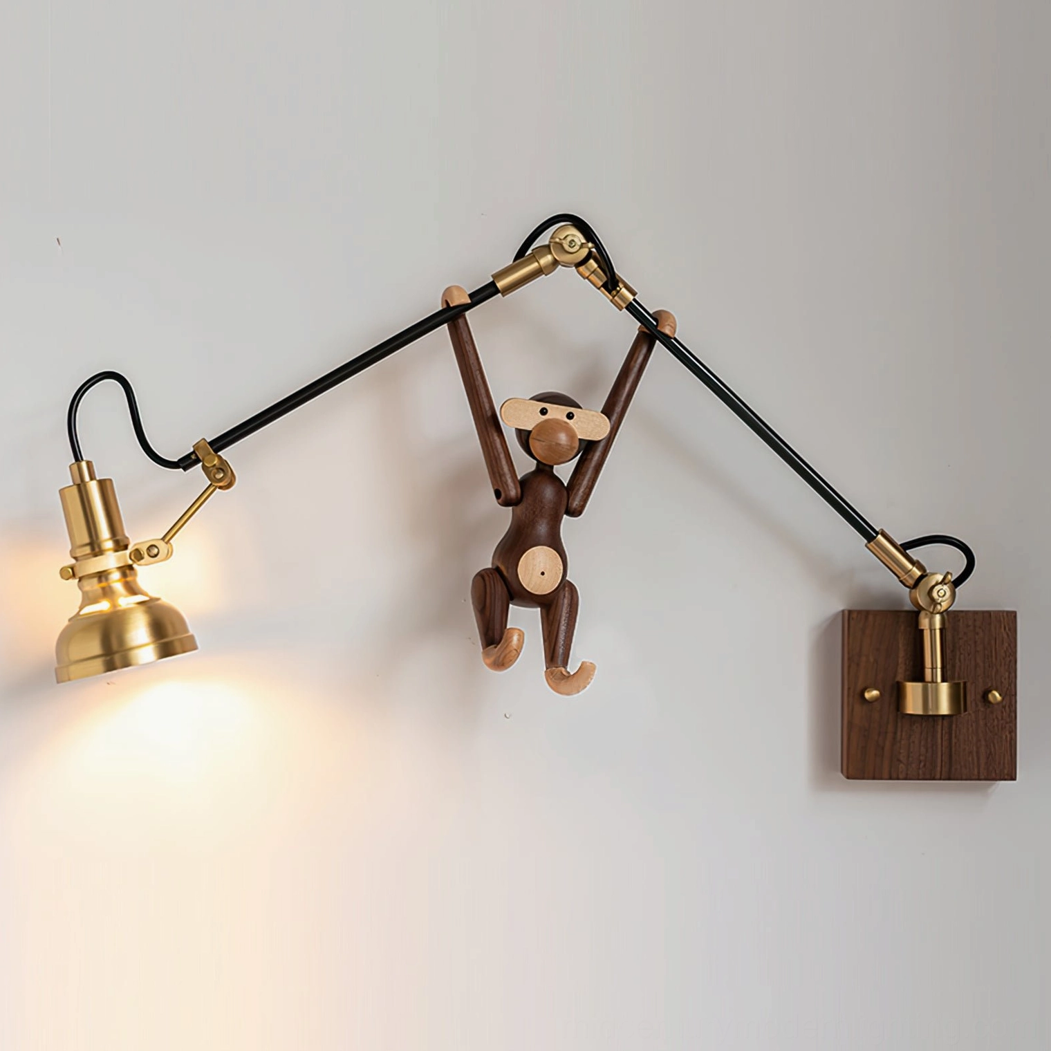 Kane Swing Arm Wall Lamp installed above decorative wooden console with pendant ornament