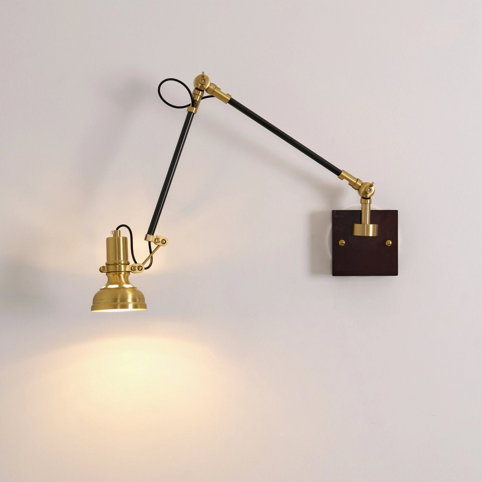 Kane Swing Arm Wall Lamp detail view of triple-pivot joint mechanism and arm articulation