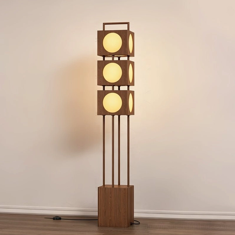Kano Totem Floor Lamp front view, illuminated in minimalist room, slim wood support poles, geometric cube-stacking architecture