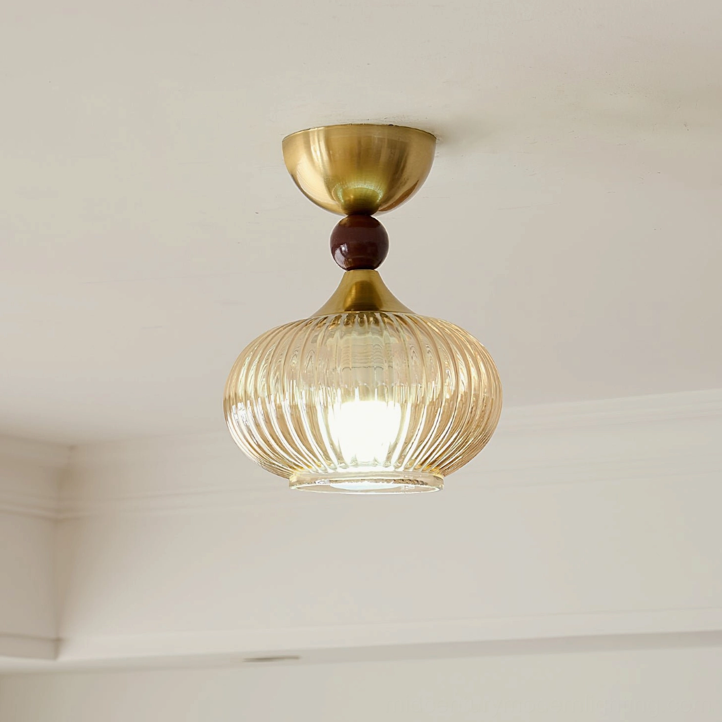 Kaydan ribbed amber glass flush ceiling lamp overhead shot vintage retro brass wood finish