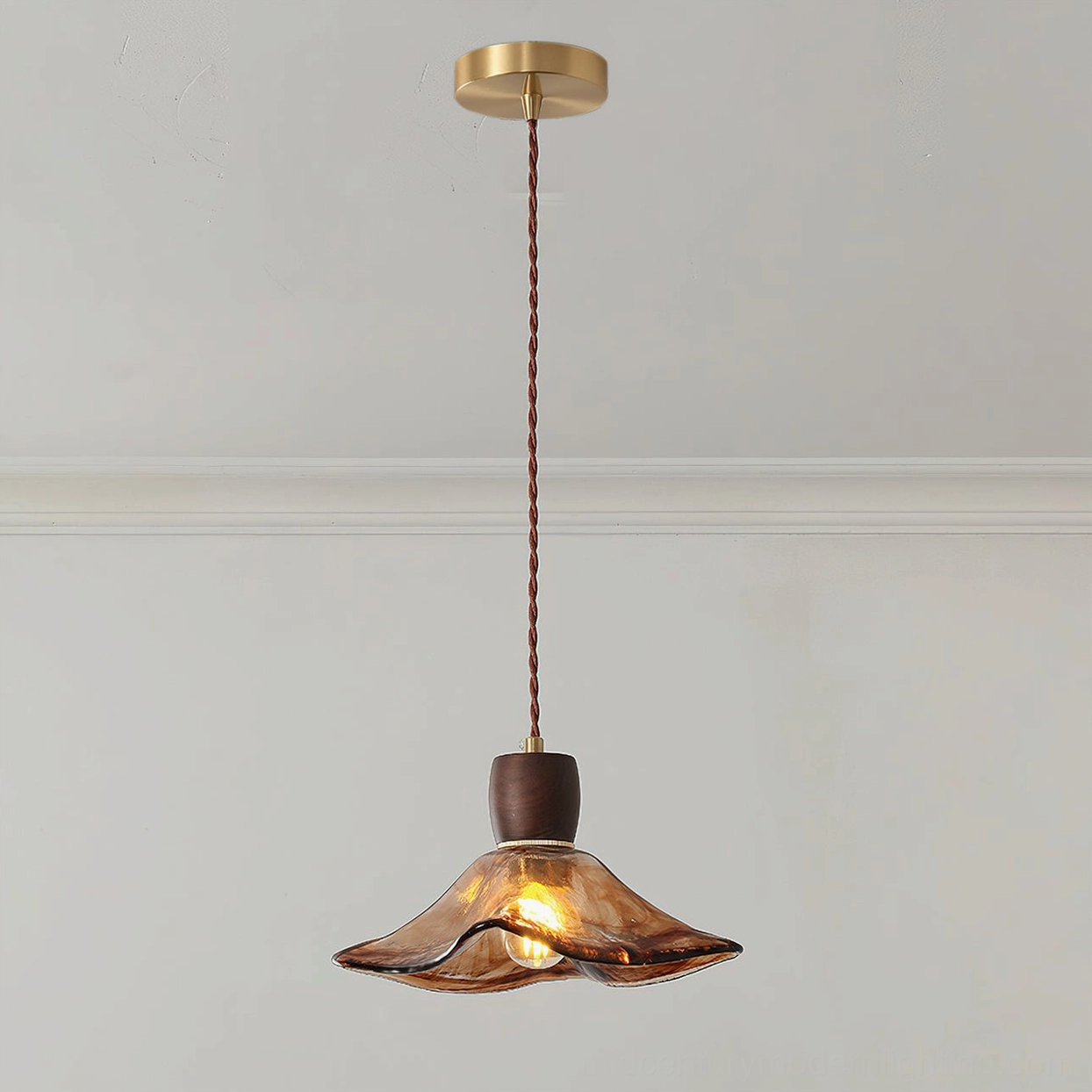 Keju hand-formed amber glass pendant lamp with brass hardware and walnut wood joint, studio front view