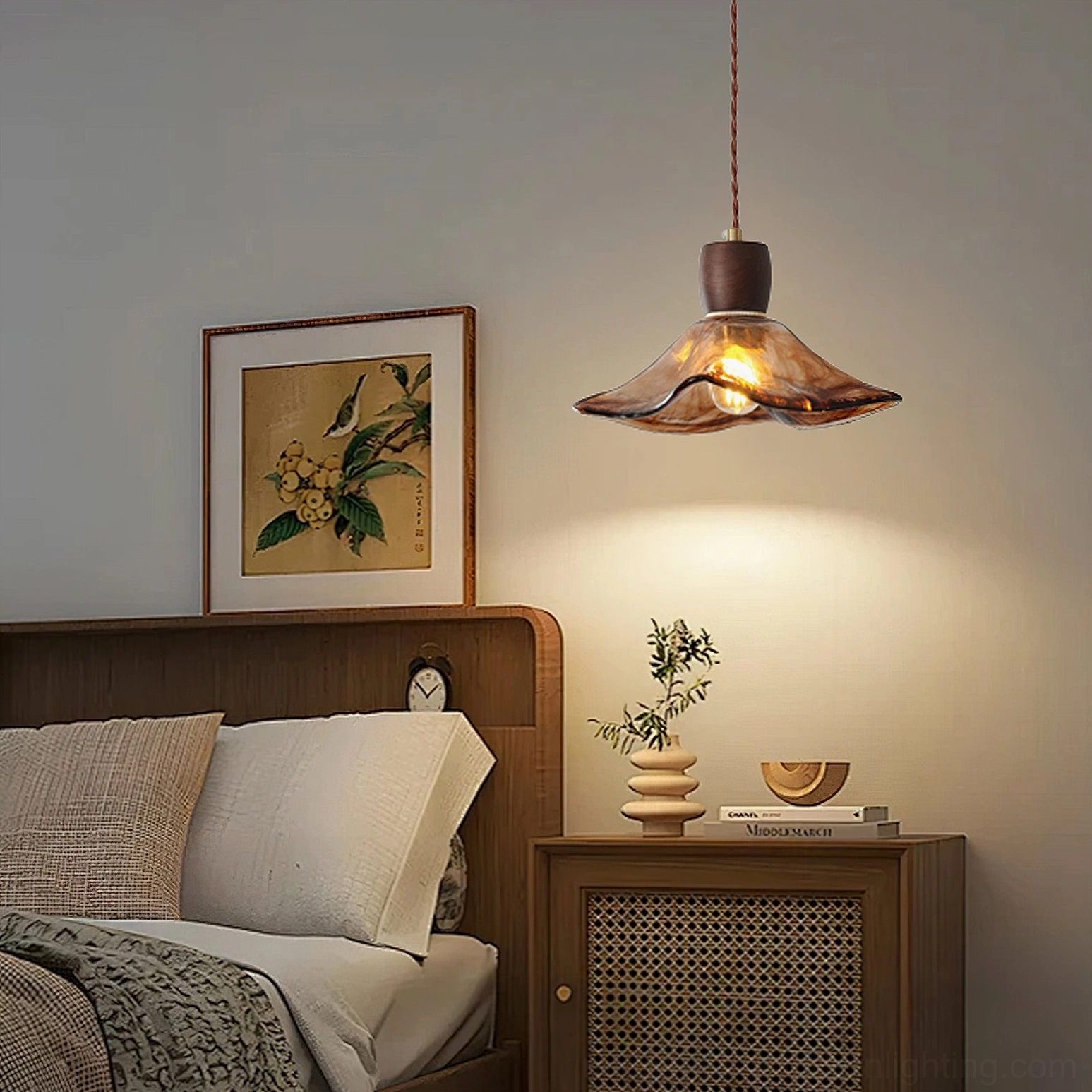 Keju amber glass pendant above rattan nightstand in modern bedroom with botanical wall art and warm golden glow