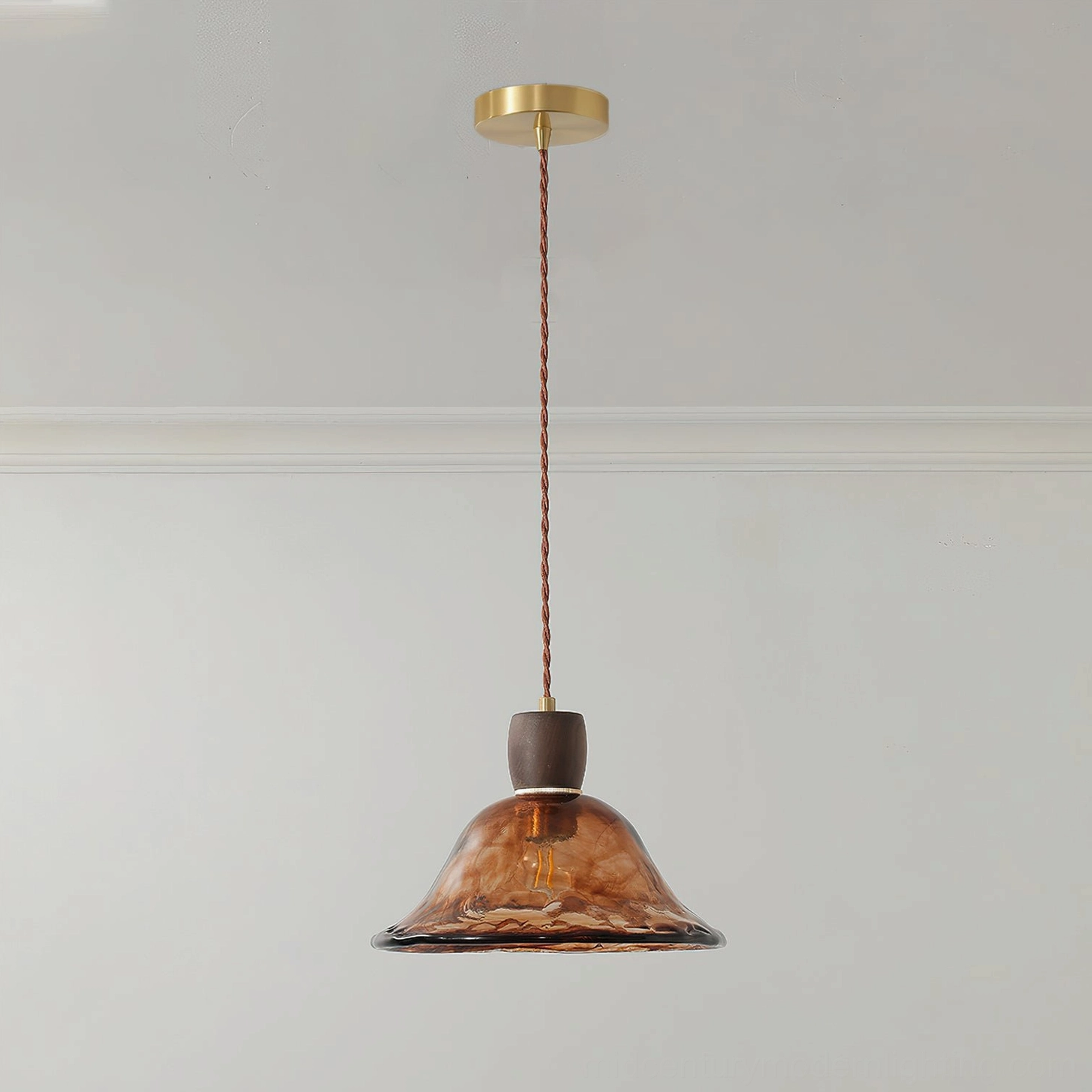 Keju wide flared amber glass pendant light with organic wavy shade, walnut wood connector and brass ceiling base
