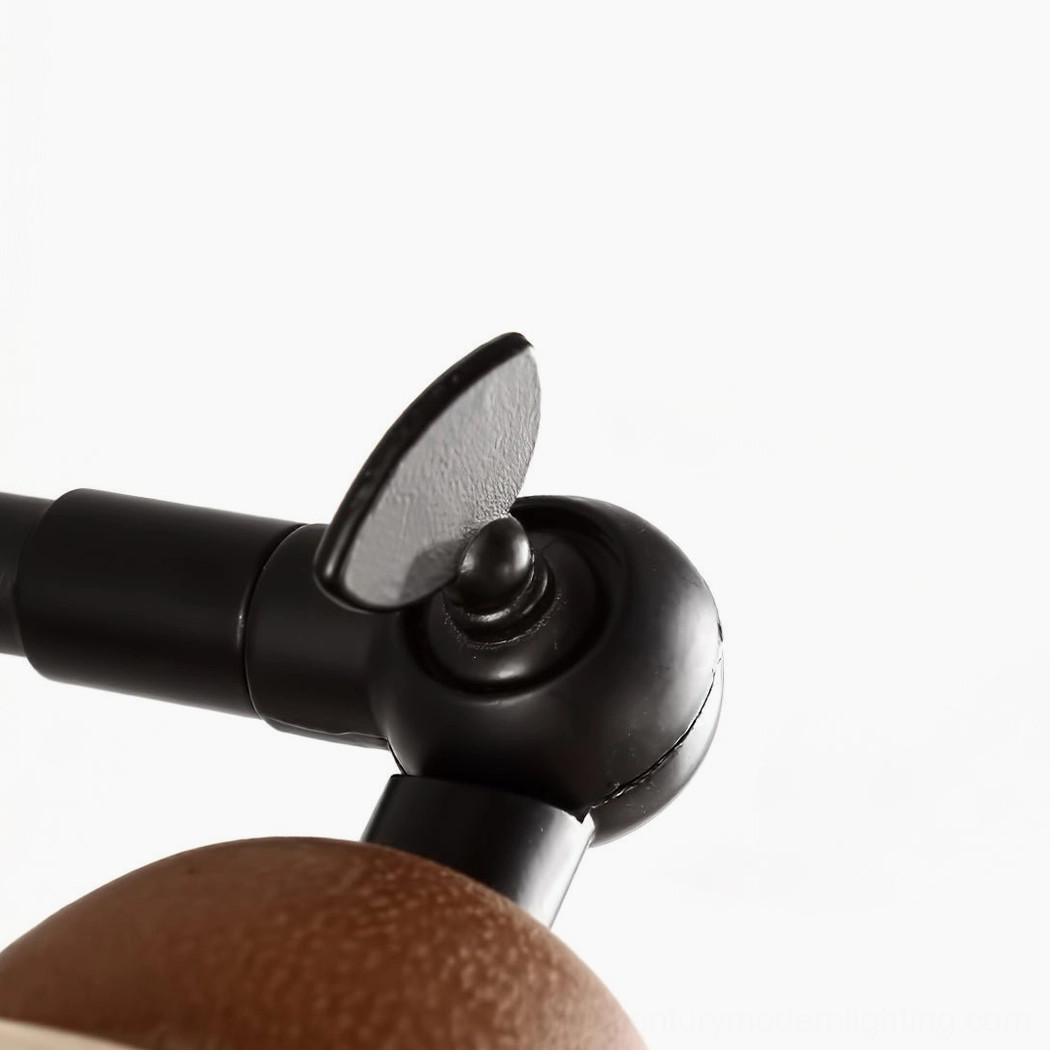 Kell wall lamp adjustable metal joint close-up, matte black articulation mechanism and precision engineering